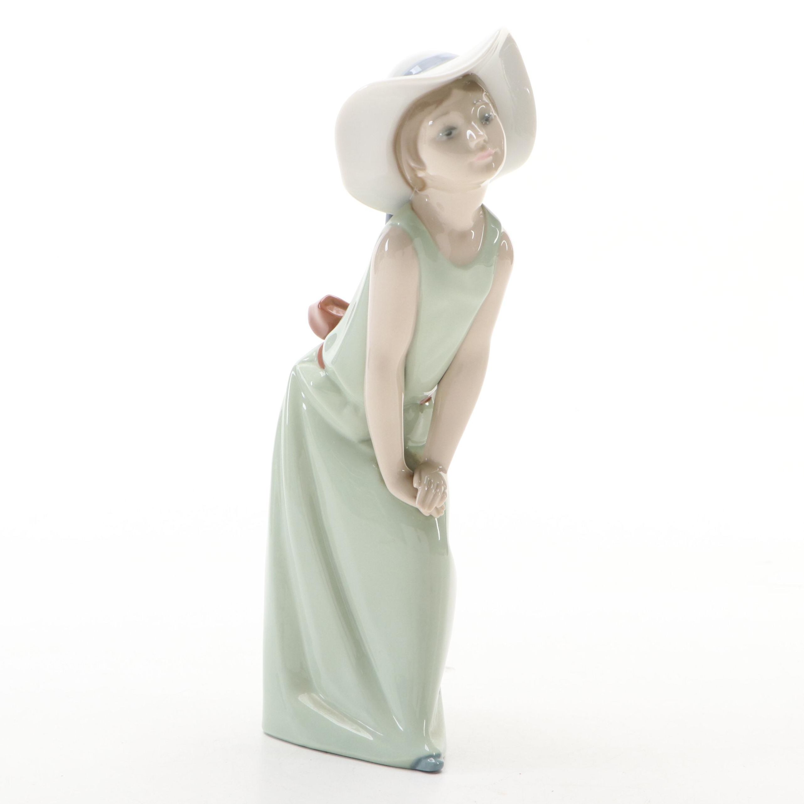 Lladró "Curious Girl with Straw Hat" Porcelain Figurine