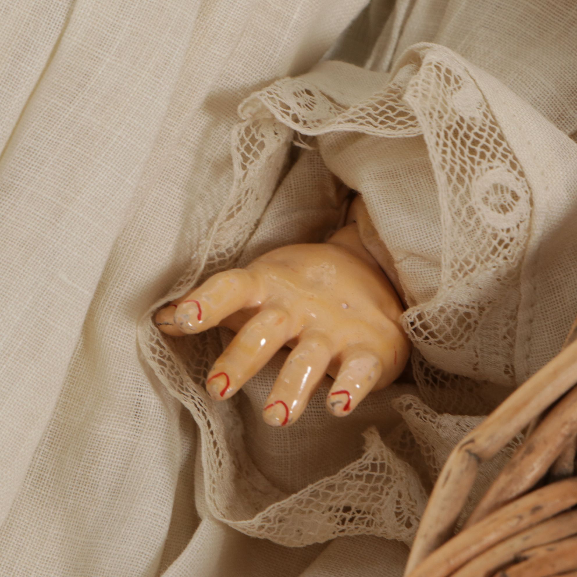 German Porcelain Open Mouth Doll with Composition Body and Wicker Cradle