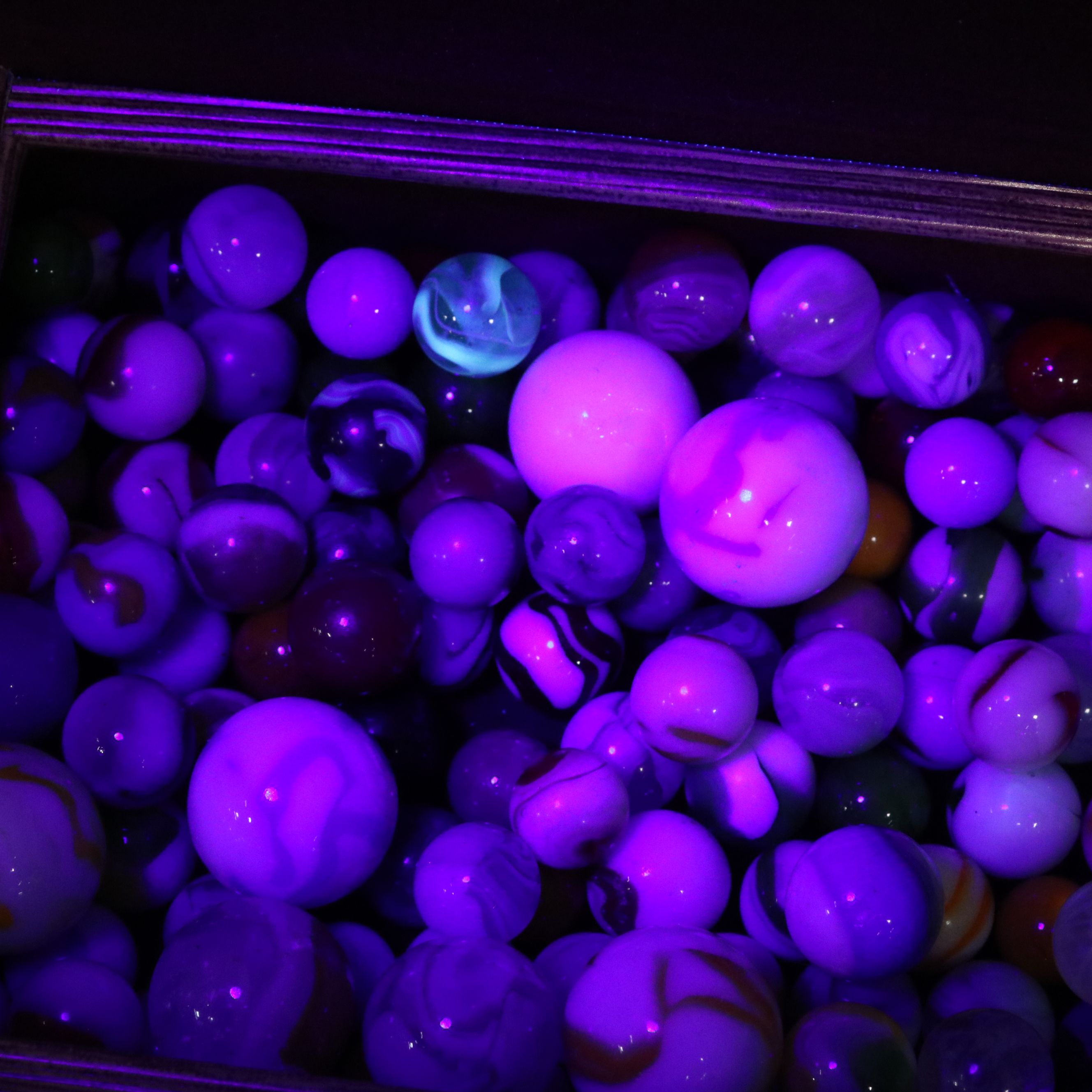 Swirlies, Shooters and Other Marbles in Decorative Boxes.