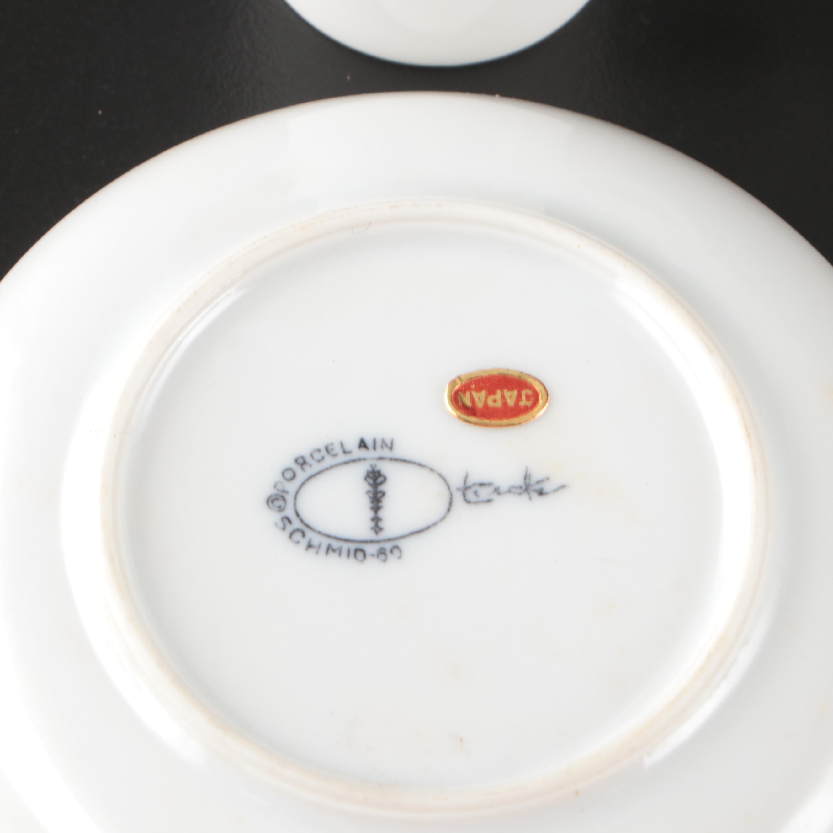 Schmid-60 Porcelain Demitasse Cups and Saucers with Carved Stone Figurine