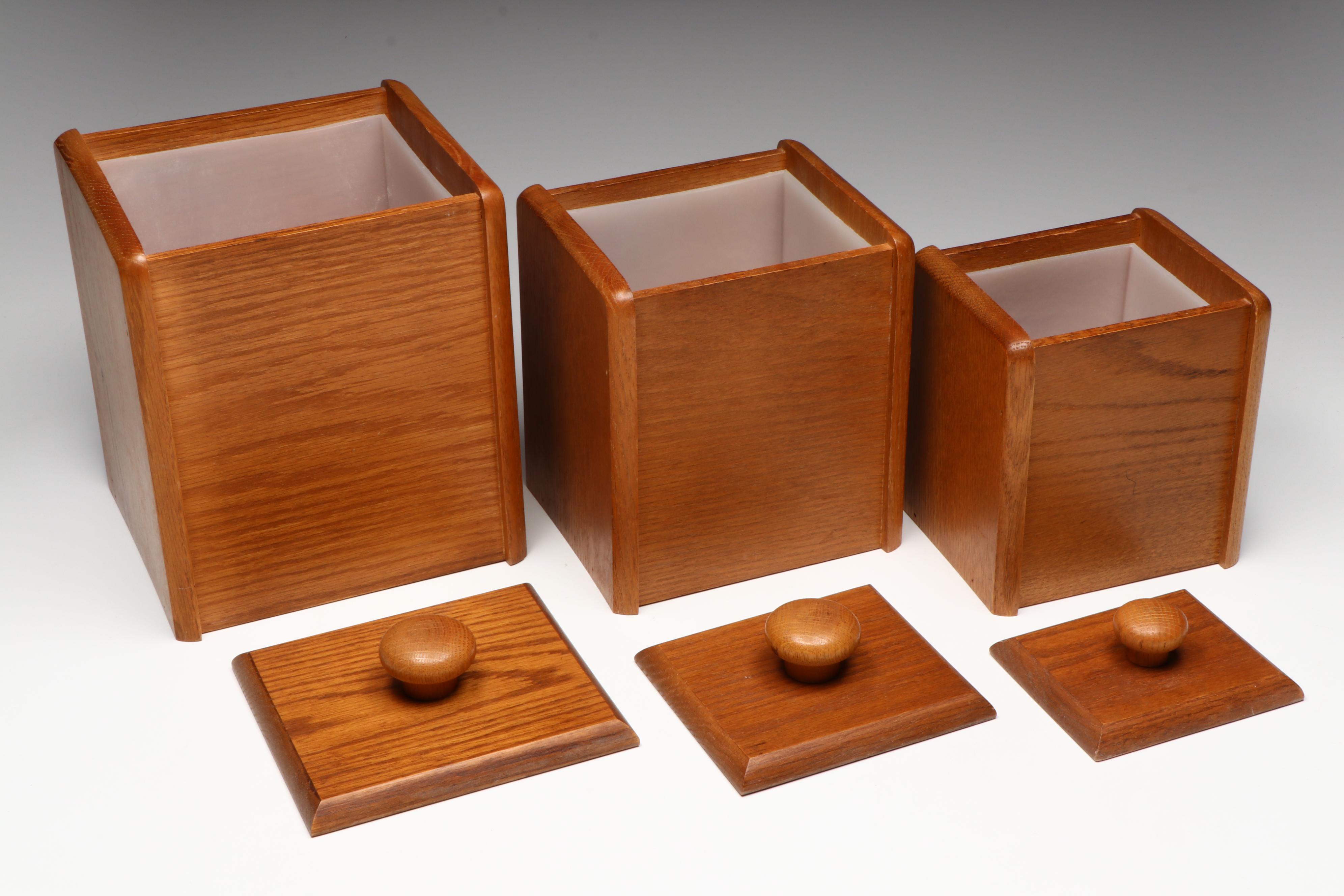 Wooden Kitchen Canisters, Ceramic Pitcher, and Glass Tumblers