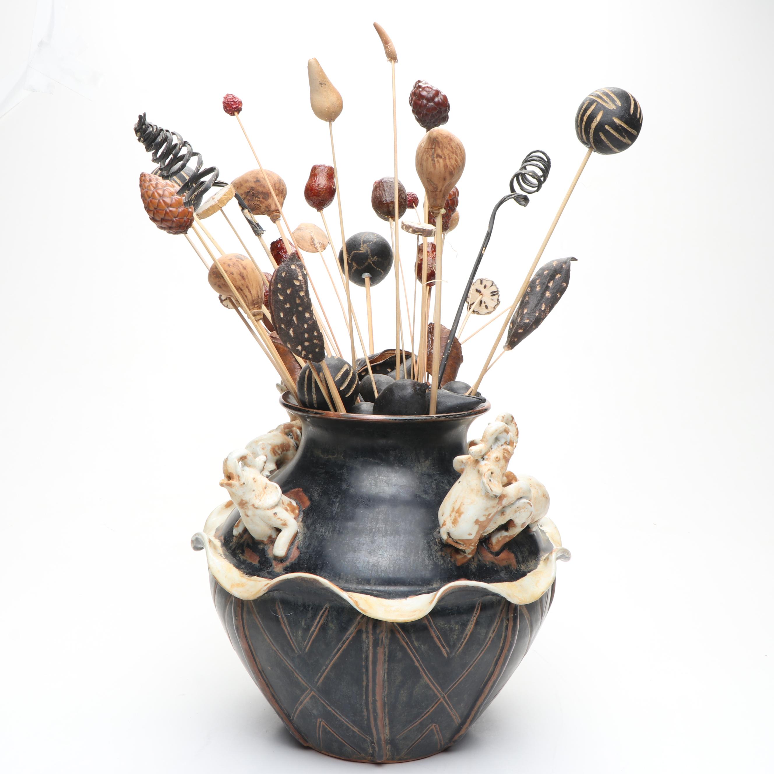 Ceramic Vase with Elephant Ornamentation and Carved Wood Seed Pod Décor