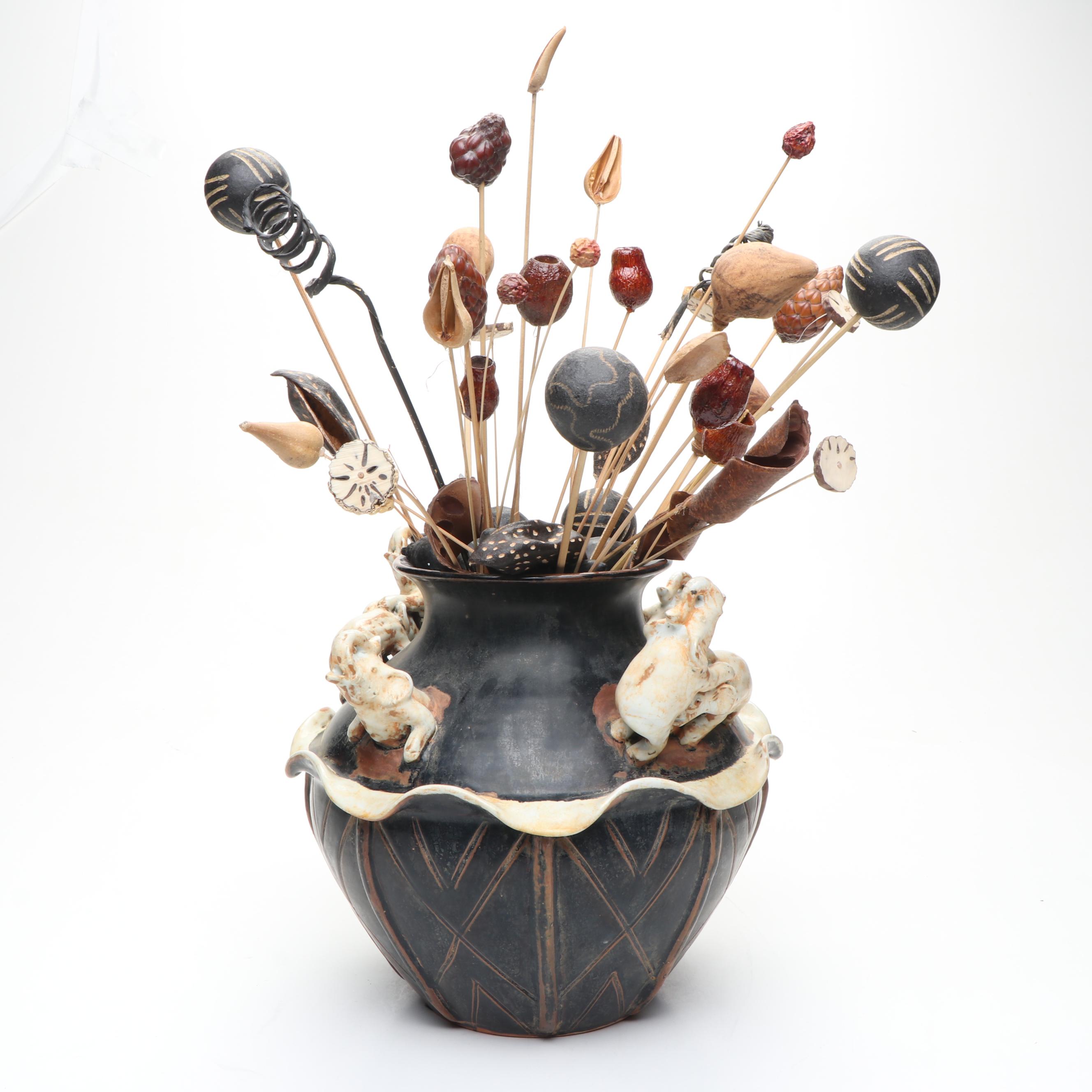 Ceramic Vase with Elephant Ornamentation and Carved Wood Seed Pod Décor