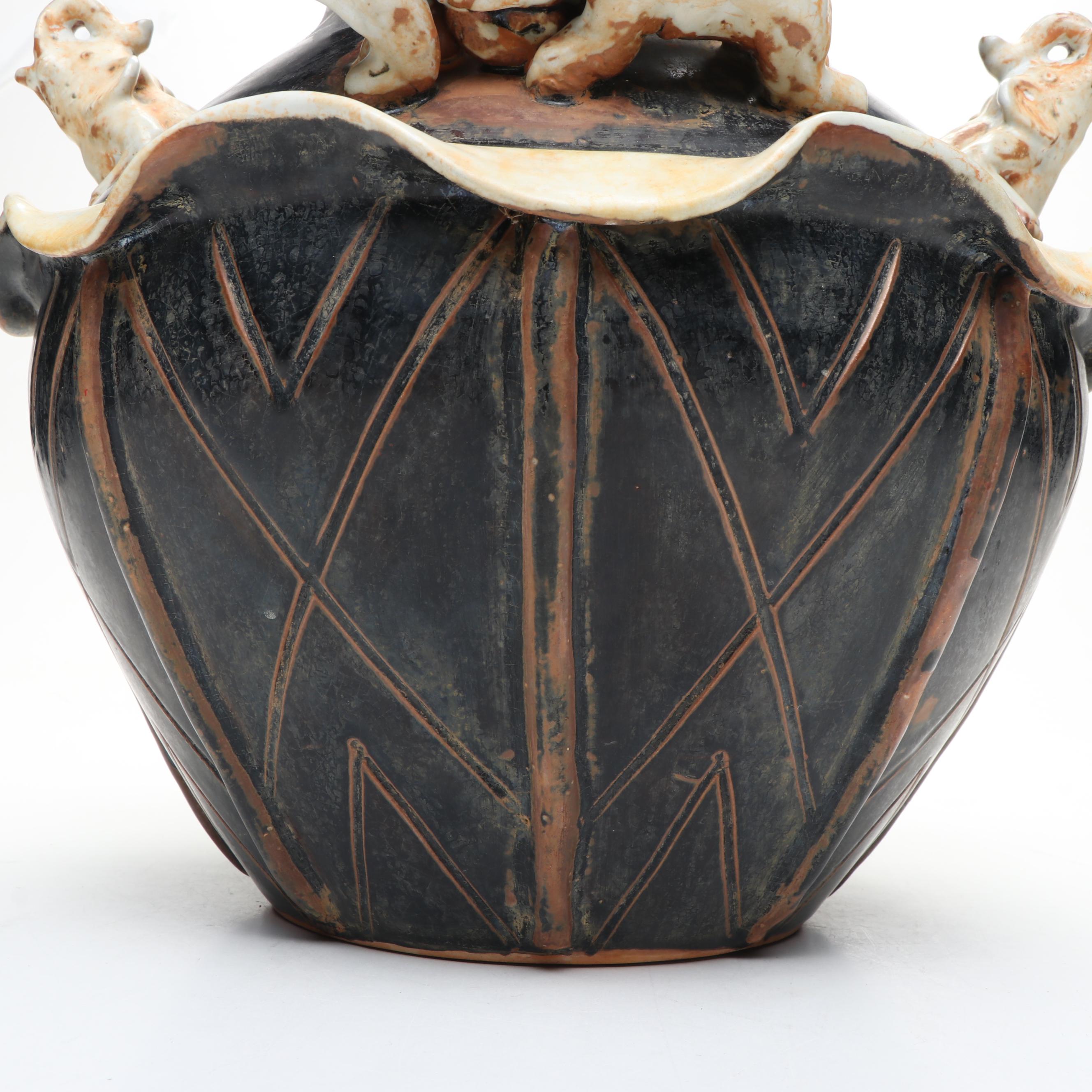 Ceramic Vase with Elephant Ornamentation and Carved Wood Seed Pod Décor