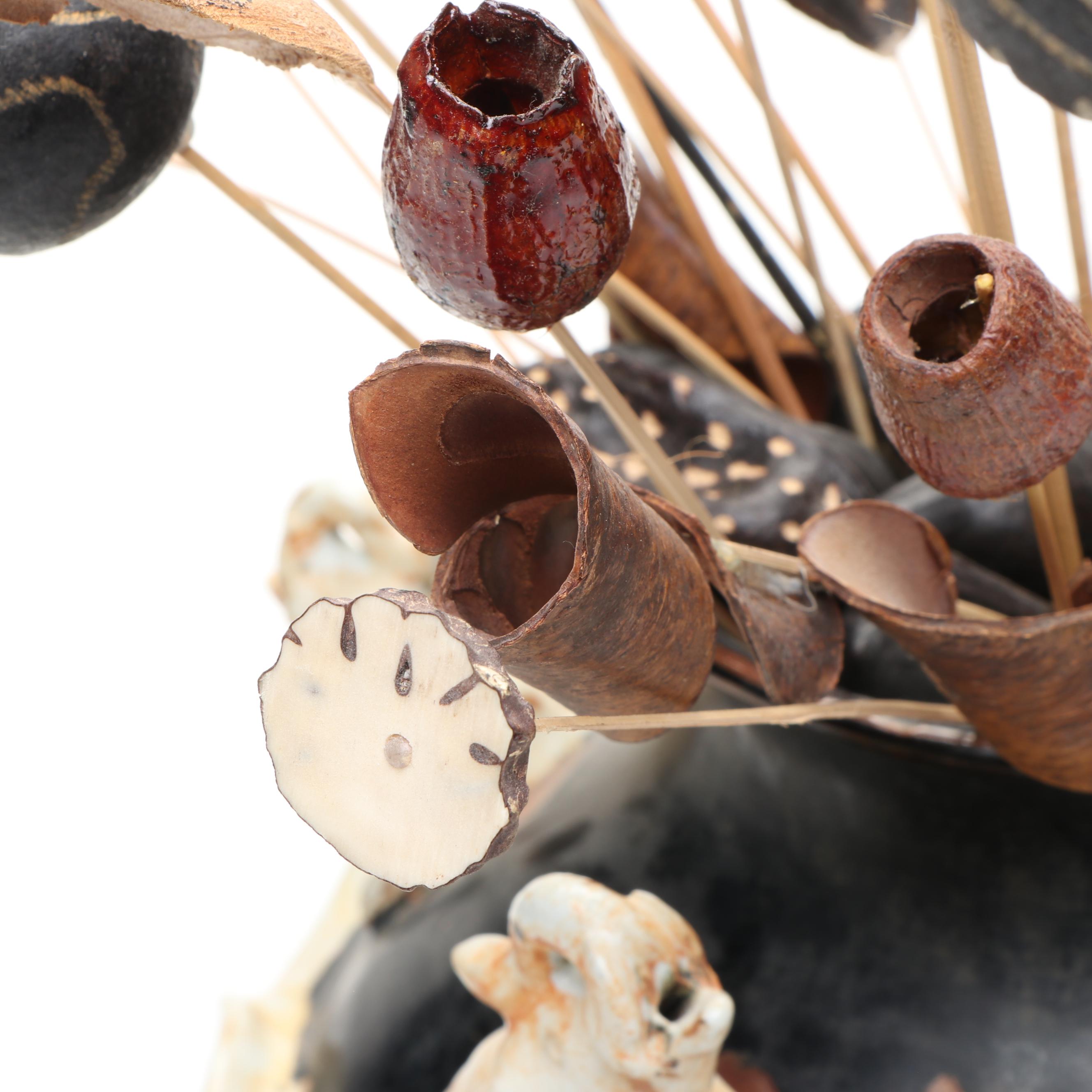 Ceramic Vase with Elephant Ornamentation and Carved Wood Seed Pod Décor