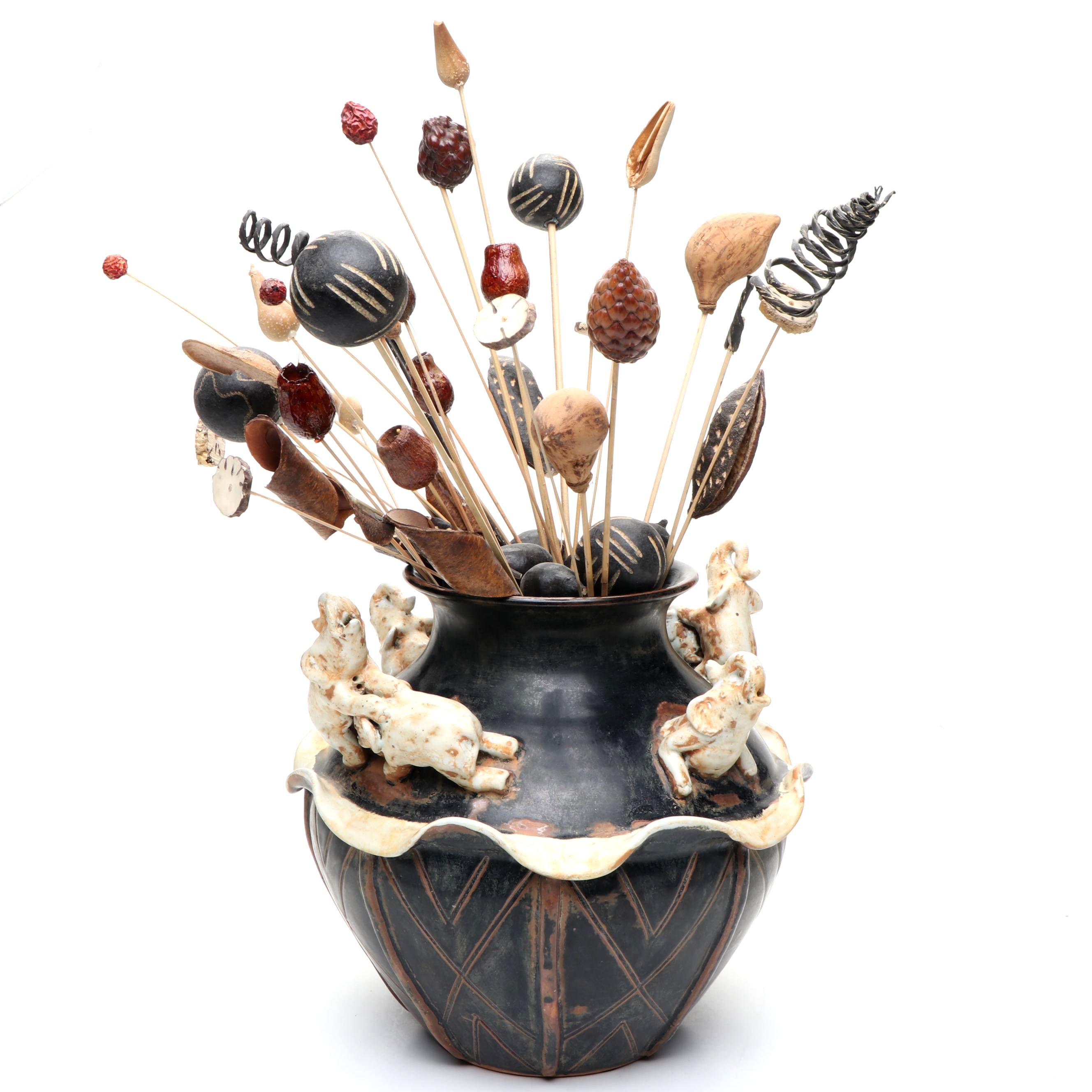 Ceramic Vase with Elephant Ornamentation and Carved Wood Seed Pod Décor