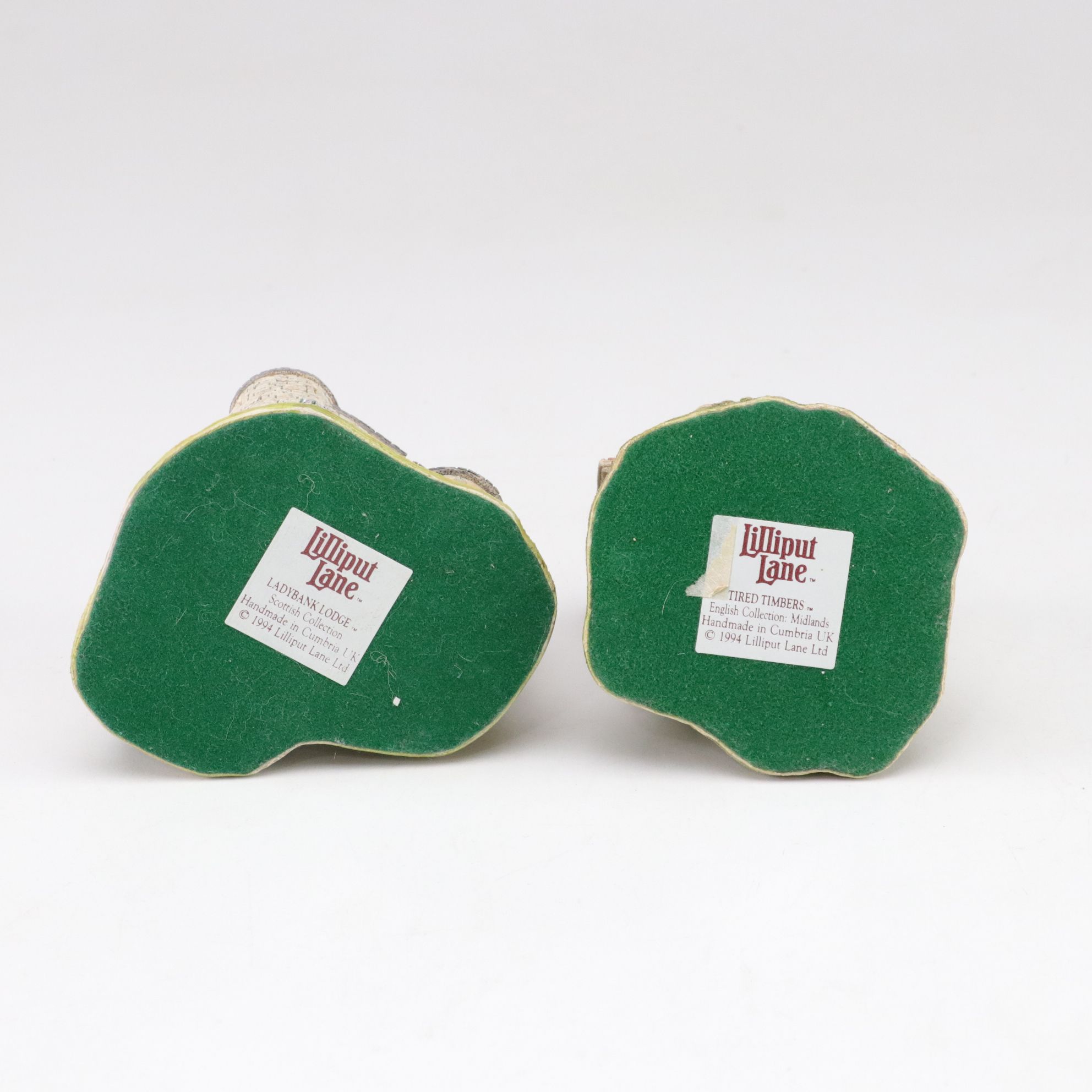 Six Lilliput Lane Buildings with "Ladybank Lodge" and "Tired Timbers" and a Sign