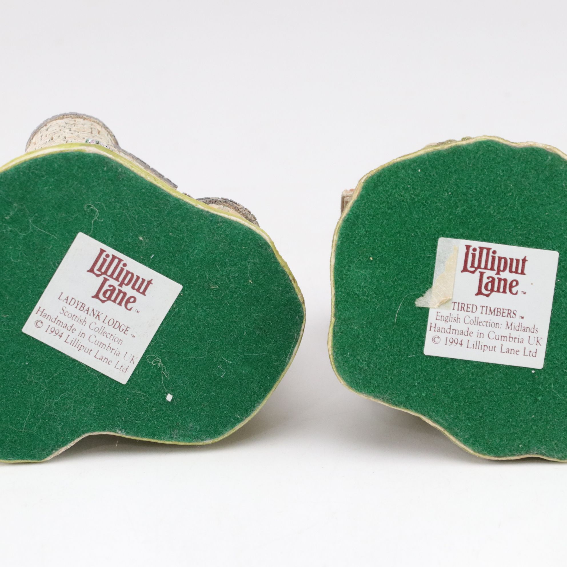 Six Lilliput Lane Buildings with "Ladybank Lodge" and "Tired Timbers" and a Sign