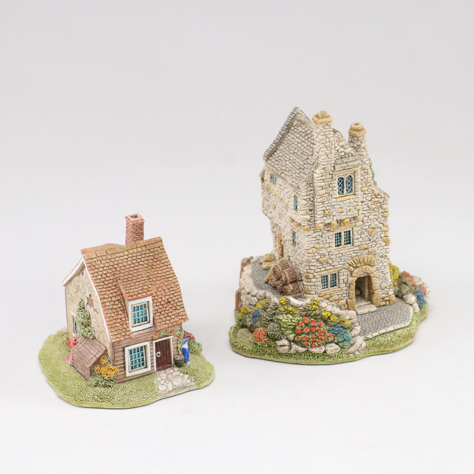 Six Lilliput Lane Buildings with "Ladybank Lodge" and "Tired Timbers" and a Sign