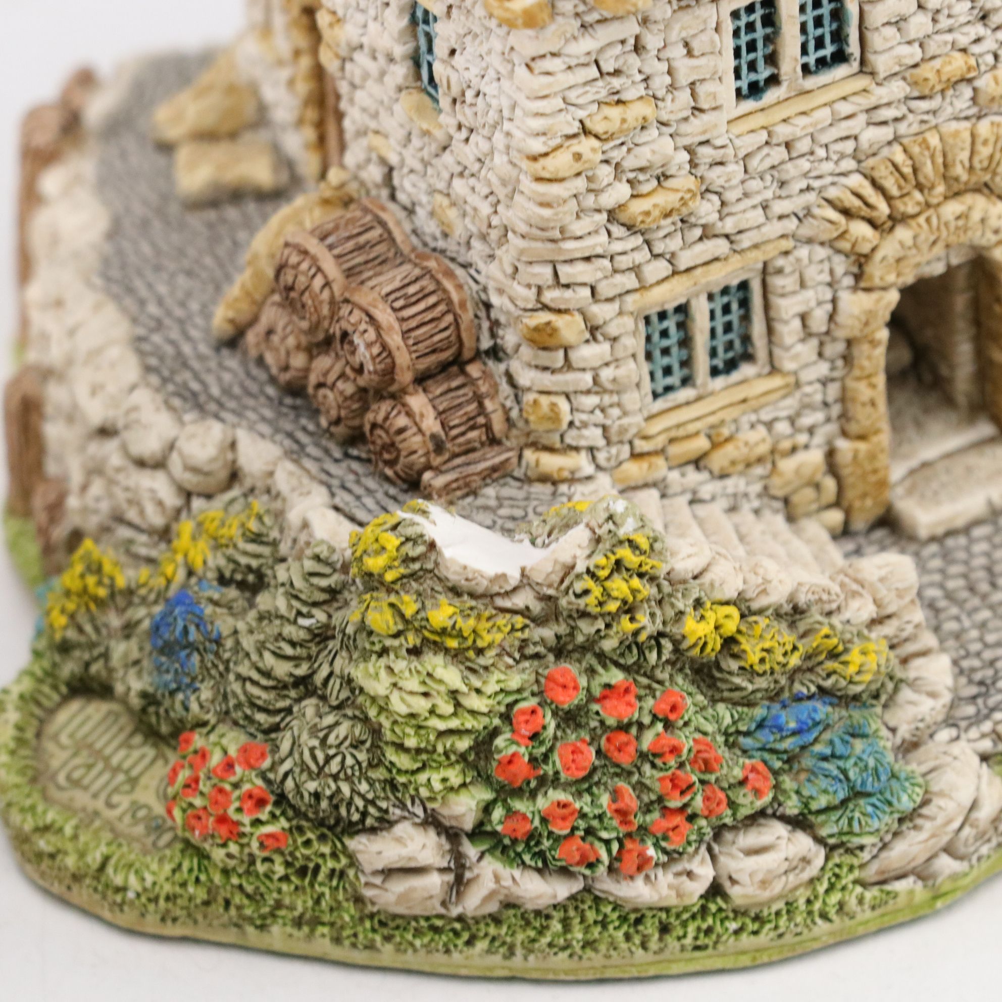 Six Lilliput Lane Buildings with "Ladybank Lodge" and "Tired Timbers" and a Sign