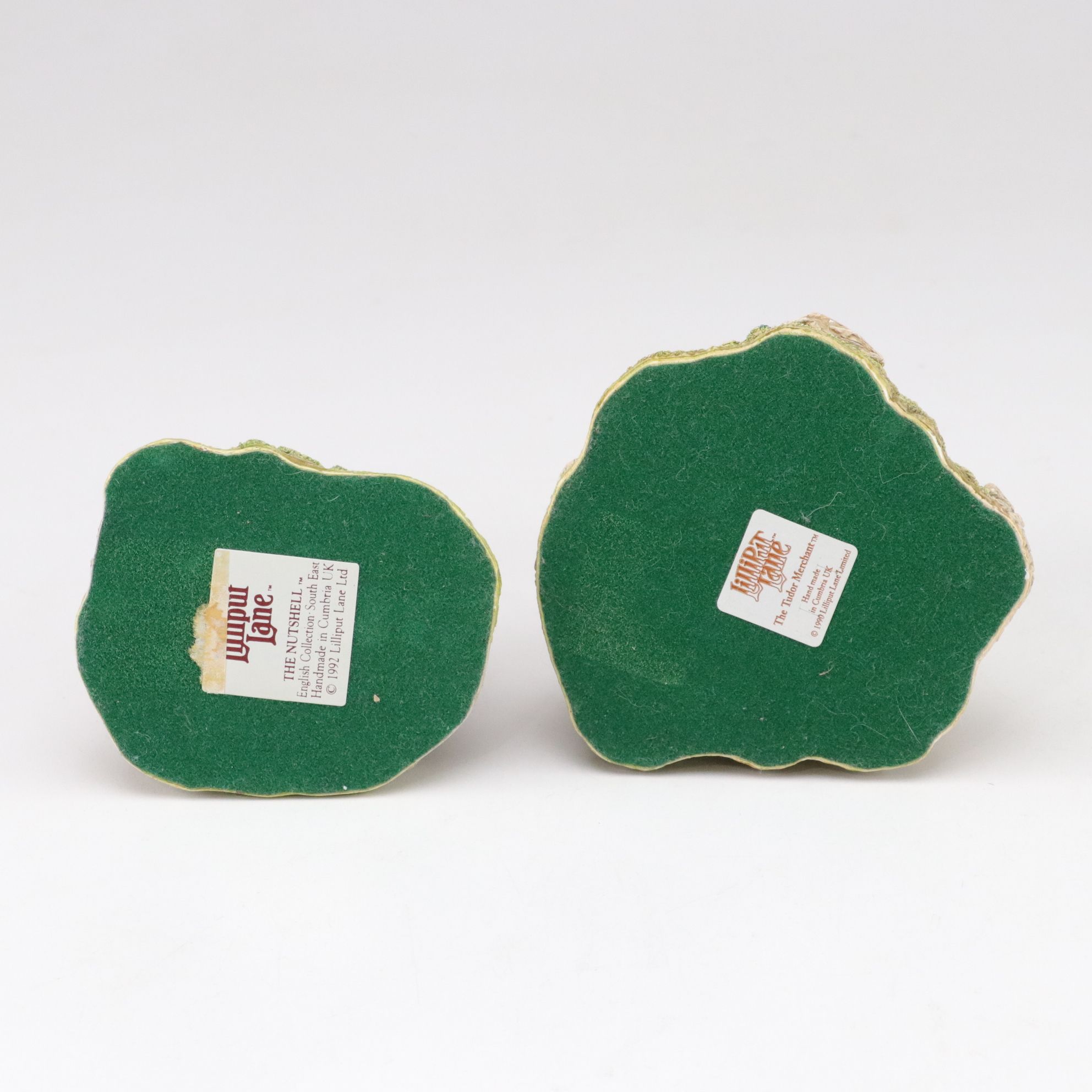 Six Lilliput Lane Buildings with "Ladybank Lodge" and "Tired Timbers" and a Sign