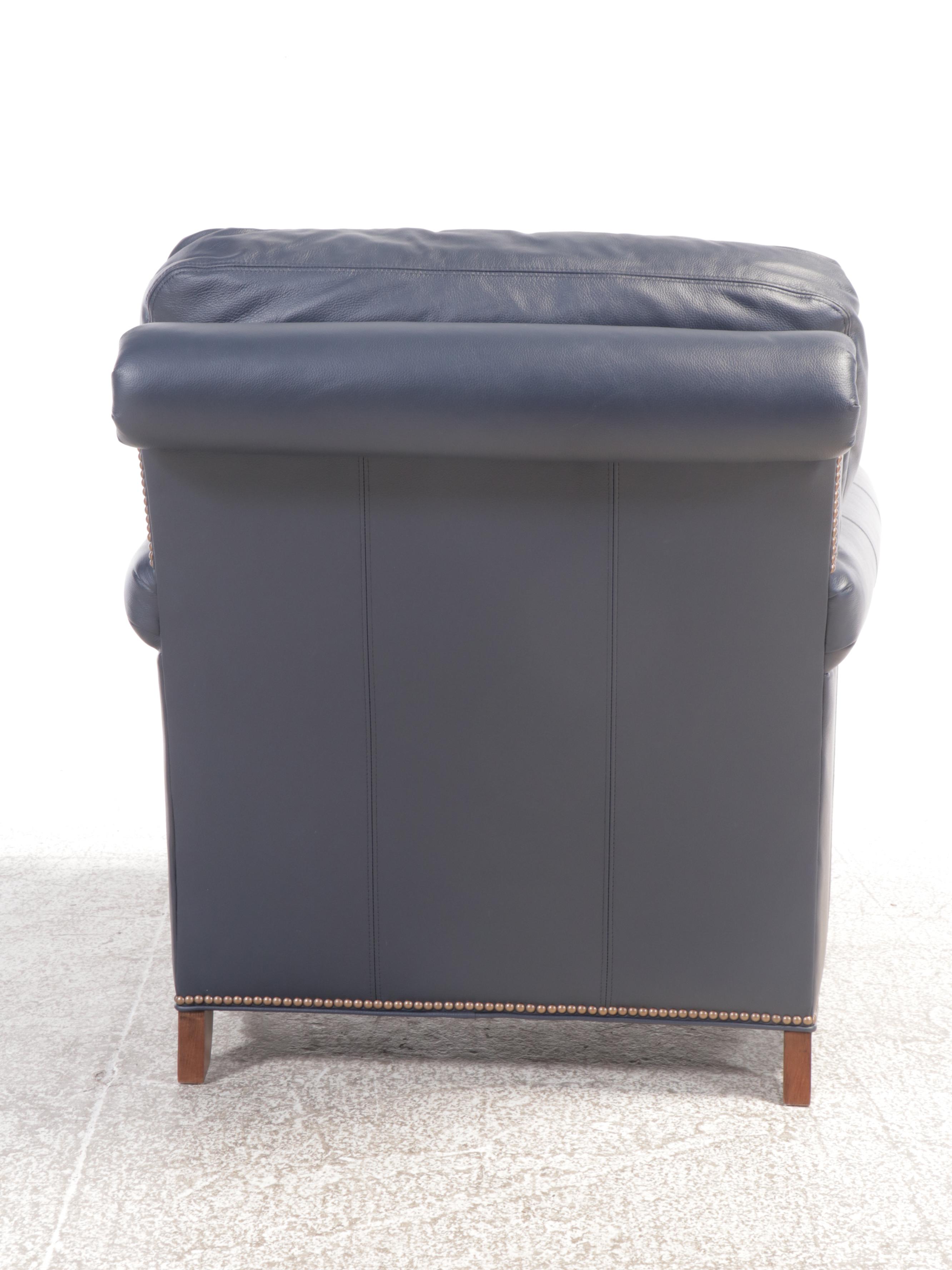 Designer's Choice Leather Upholstered Armchair and Ottoman with Nailhead Trim