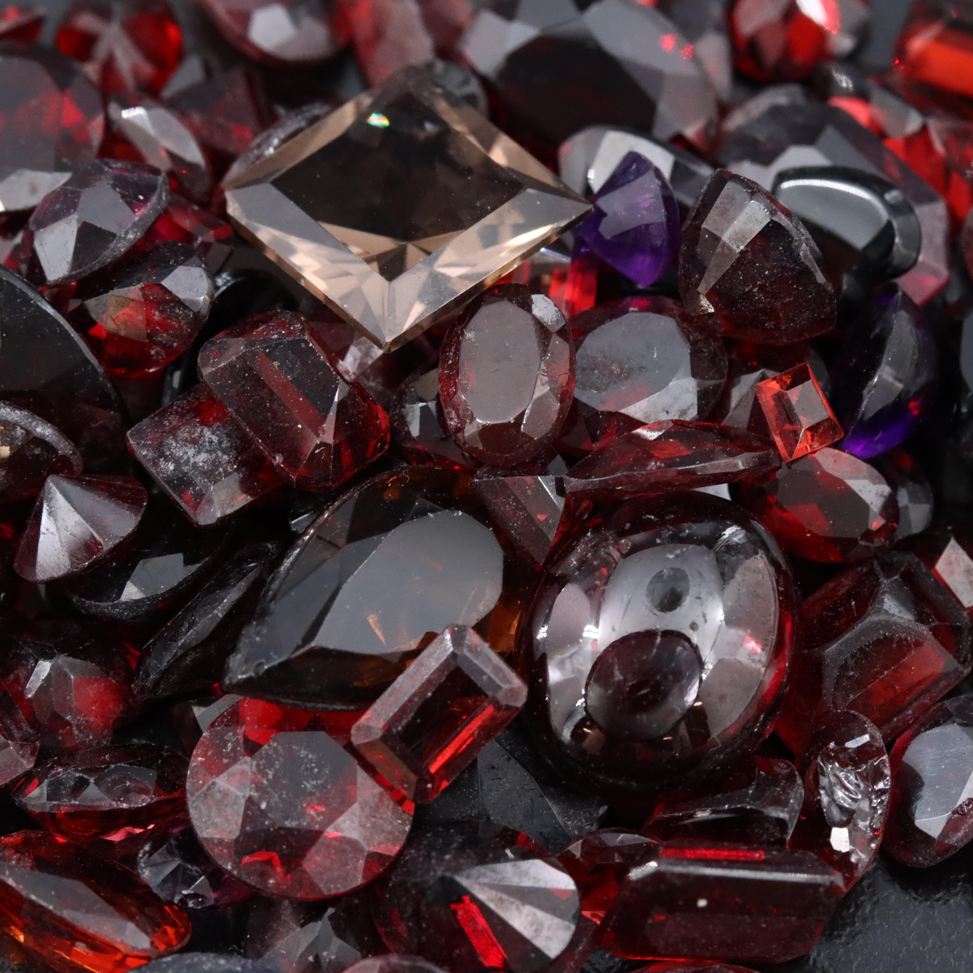 Loose 150.32 CTW Gemstones Including Garnet, Smoky Quartz and Amethyst