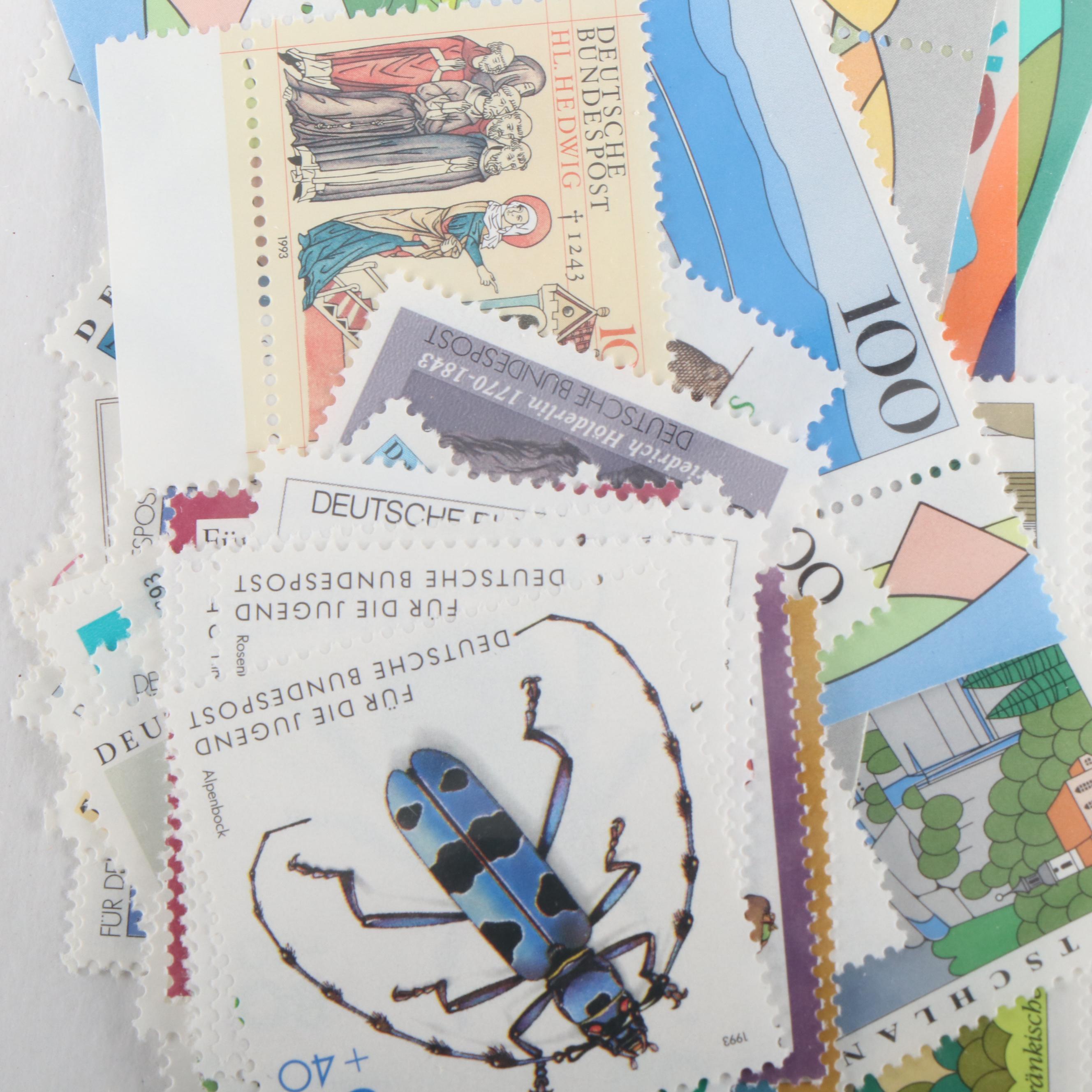 Collection of German Stamps, Year Sets, an Album, and Lots of German Mounts