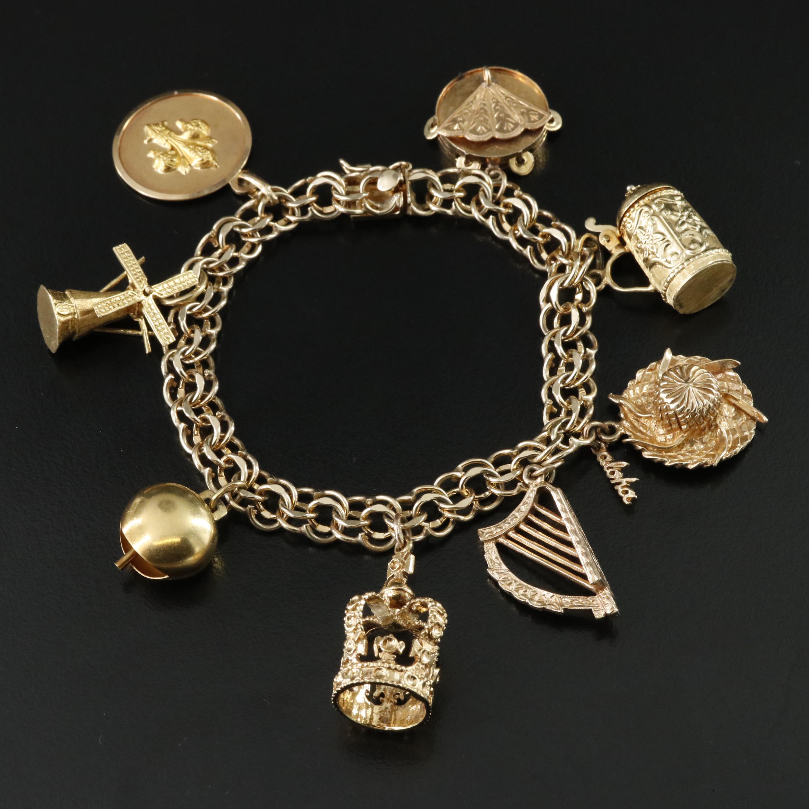 14K Charm Bracelet Including 18K, 10K, 9K and Articulated Charms
