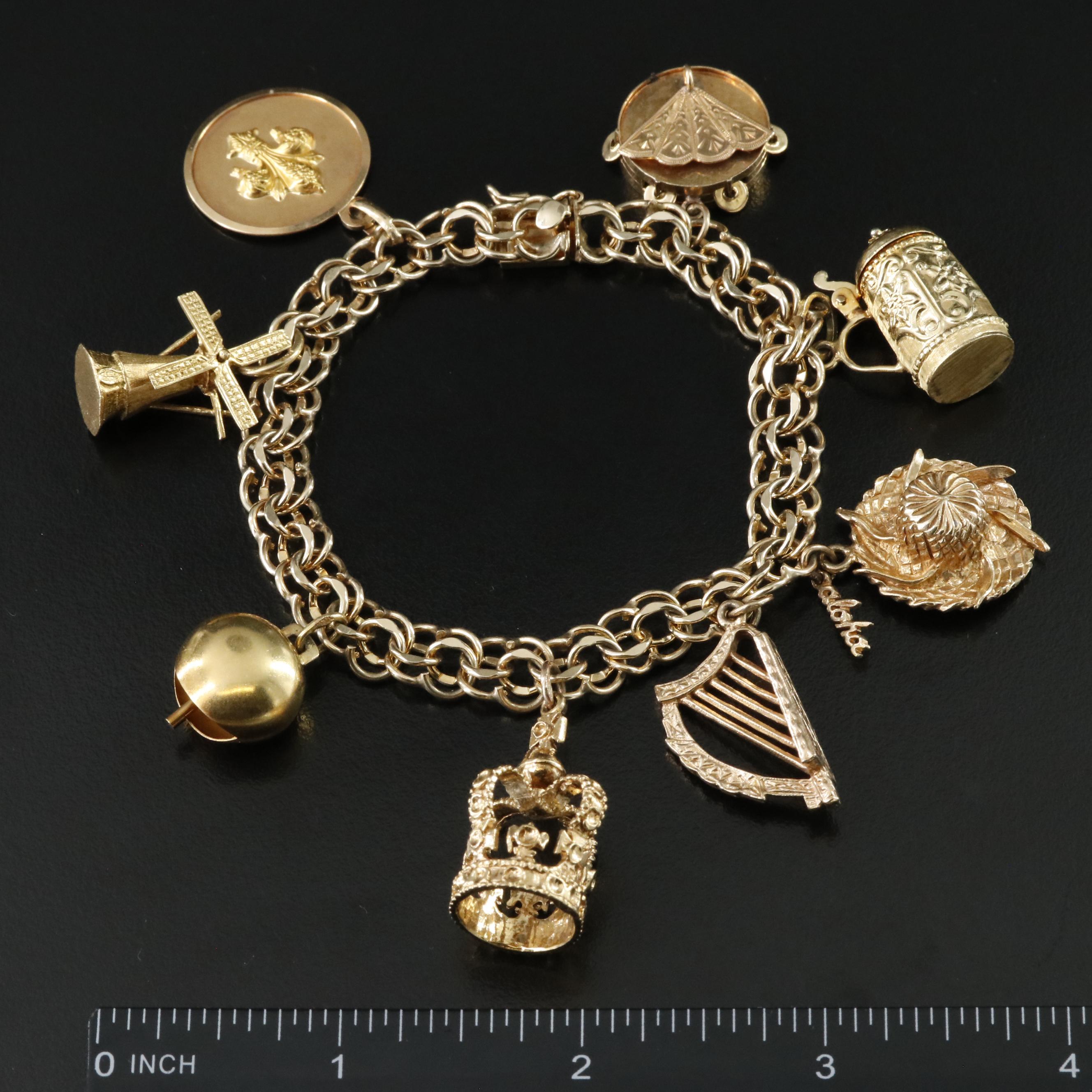 14K Charm Bracelet Including 18K, 10K, 9K and Articulated Charms