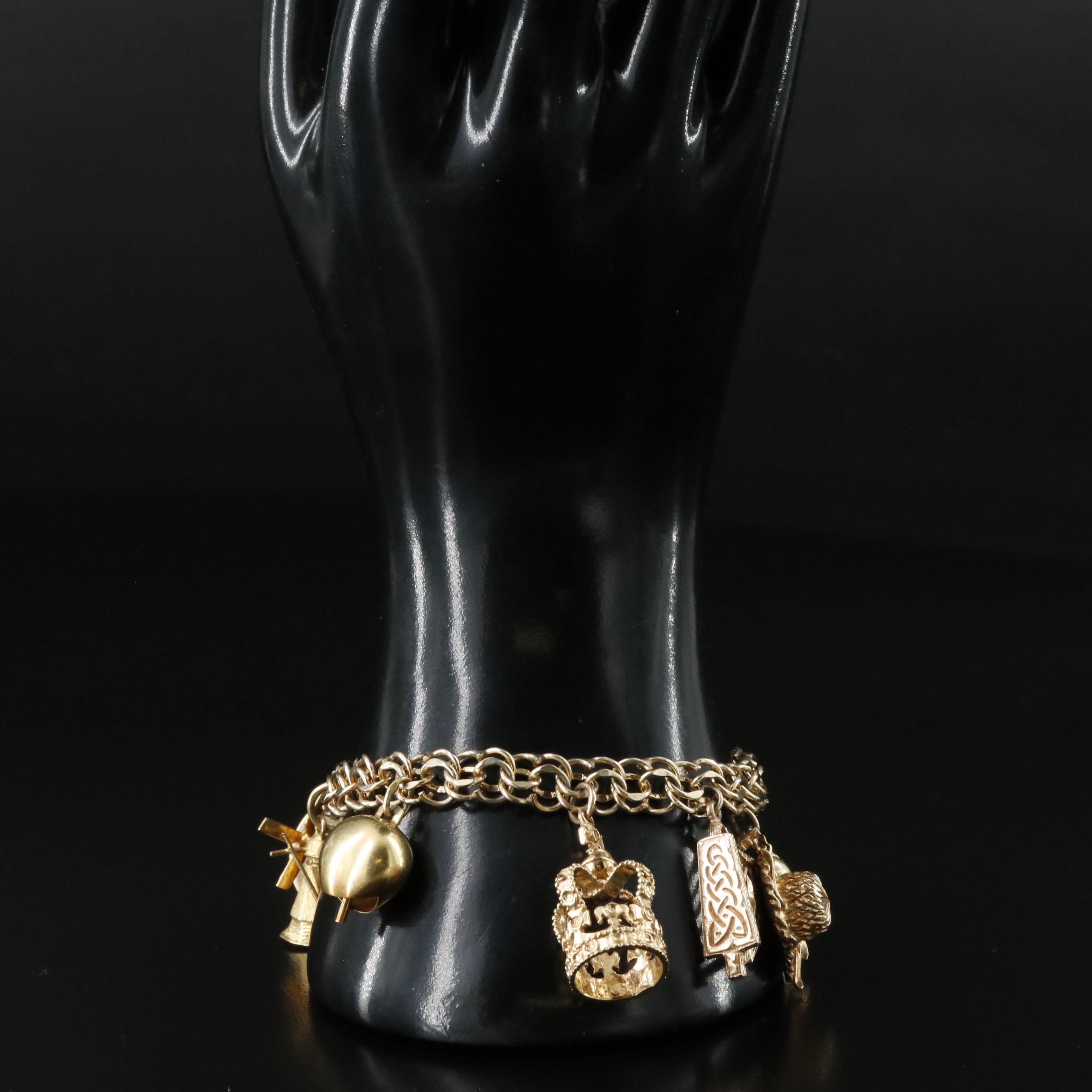 14K Charm Bracelet Including 18K, 10K, 9K and Articulated Charms