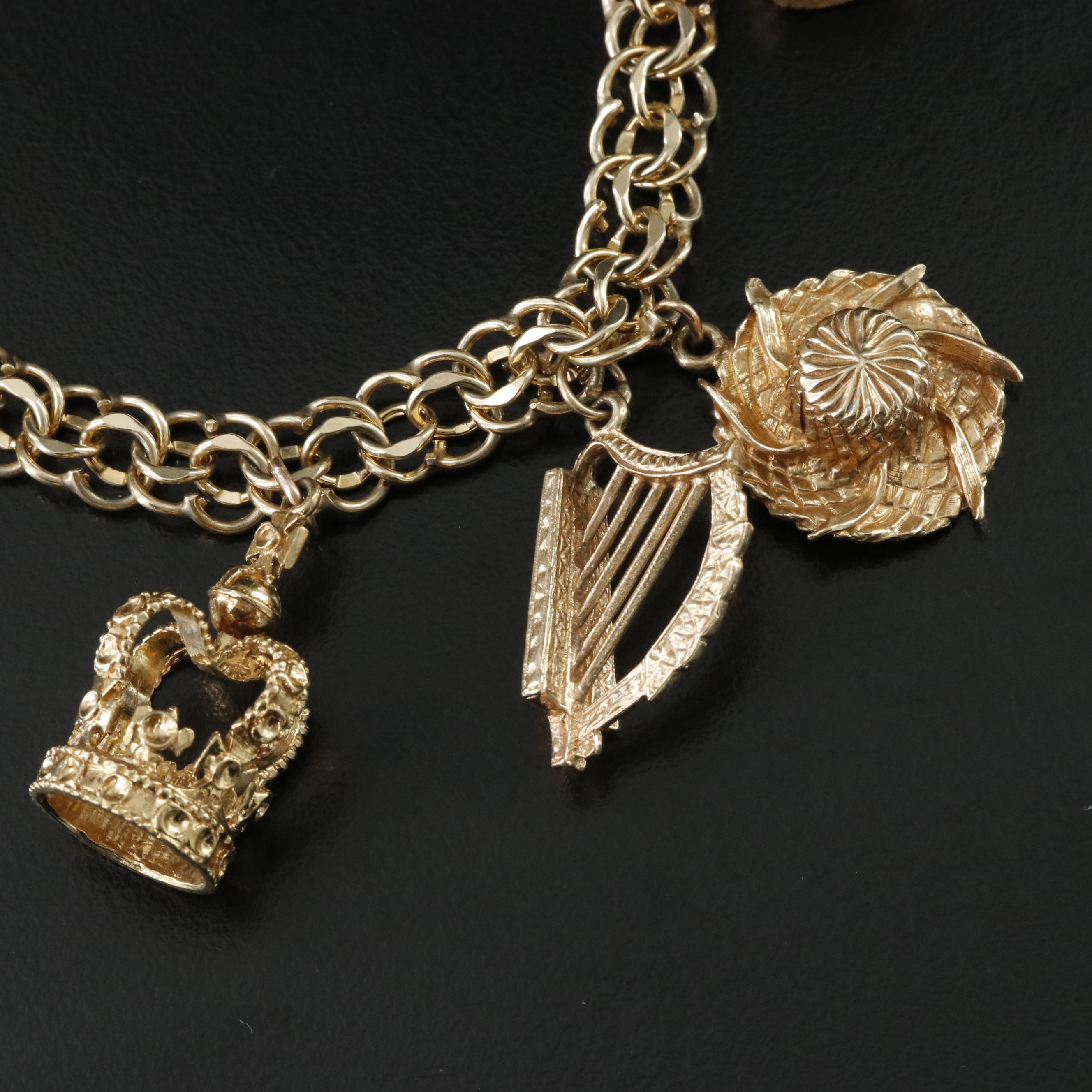 14K Charm Bracelet Including 18K, 10K, 9K and Articulated Charms