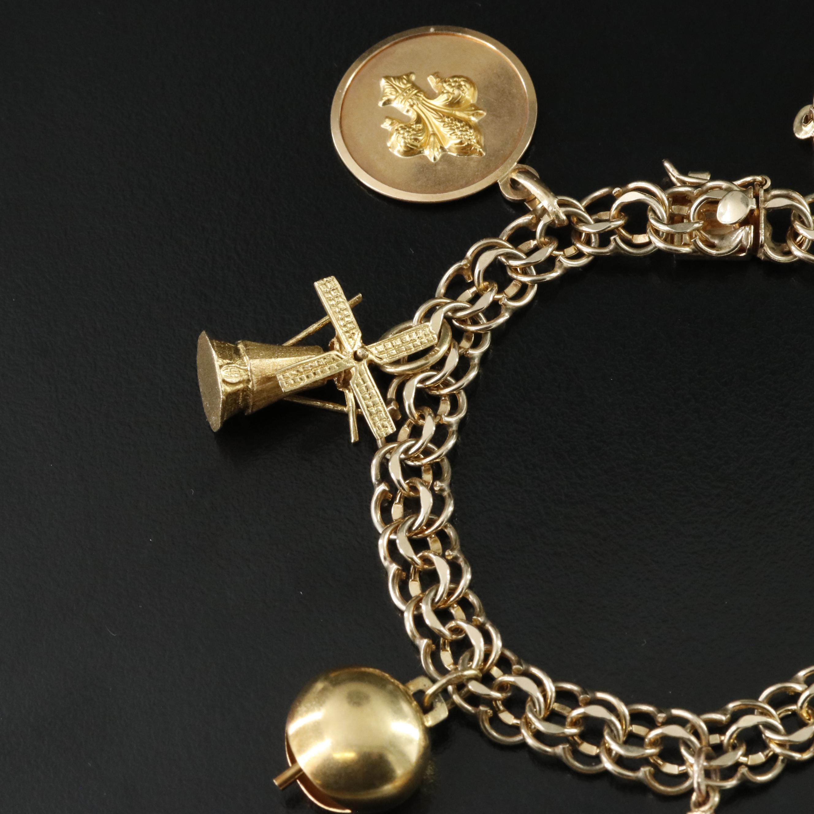 14K Charm Bracelet Including 18K, 10K, 9K and Articulated Charms