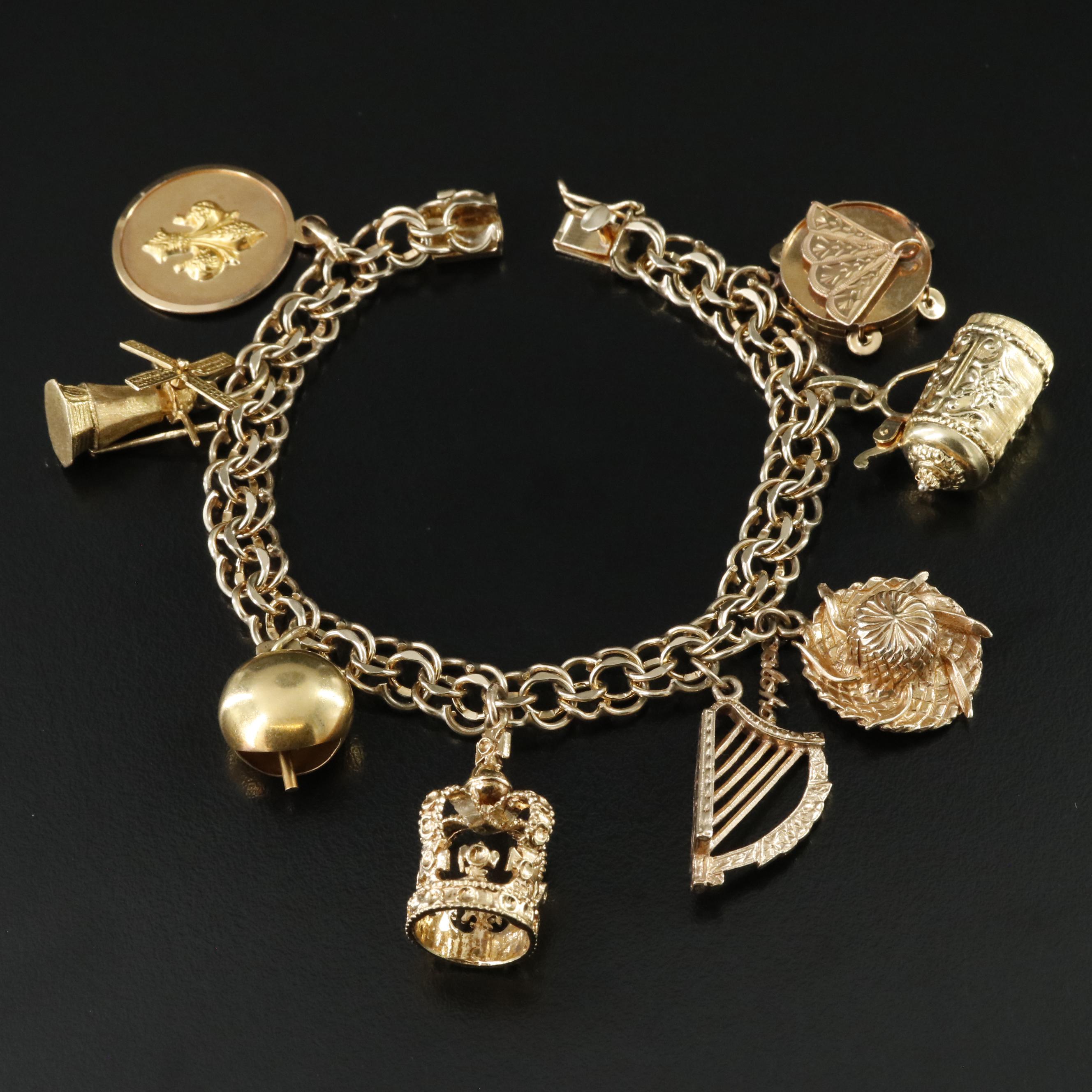 14K Charm Bracelet Including 18K, 10K, 9K and Articulated Charms