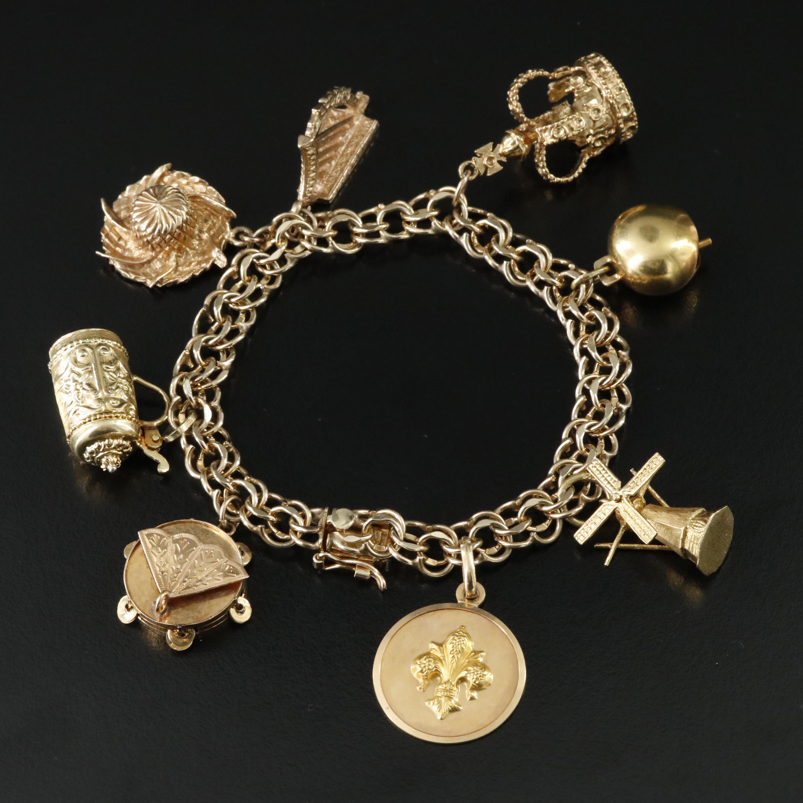 14K Charm Bracelet Including 18K, 10K, 9K and Articulated Charms