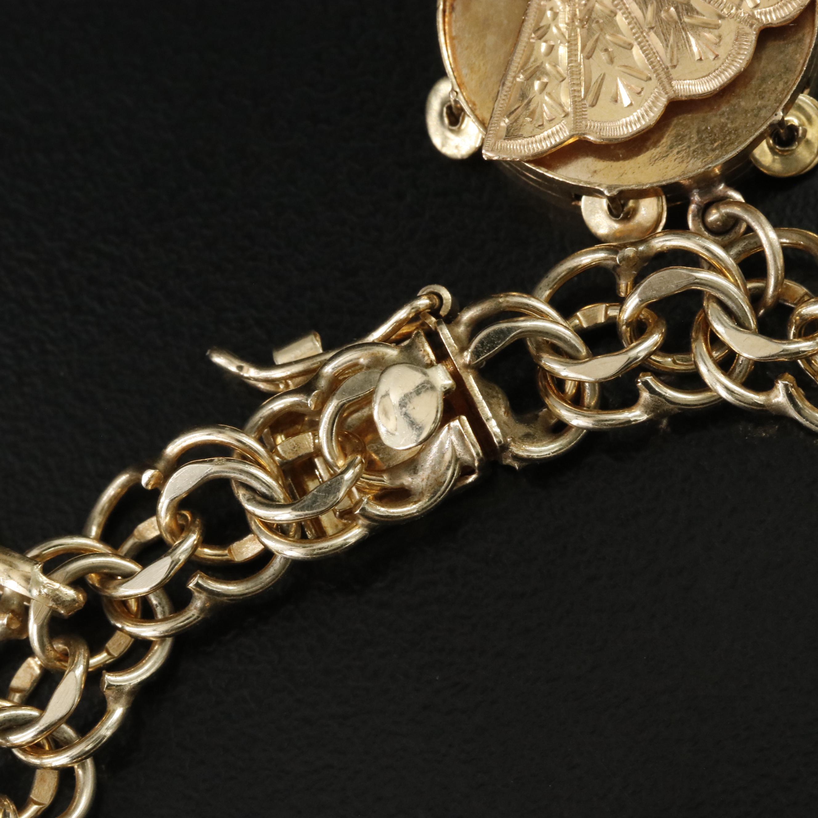 14K Charm Bracelet Including 18K, 10K, 9K and Articulated Charms