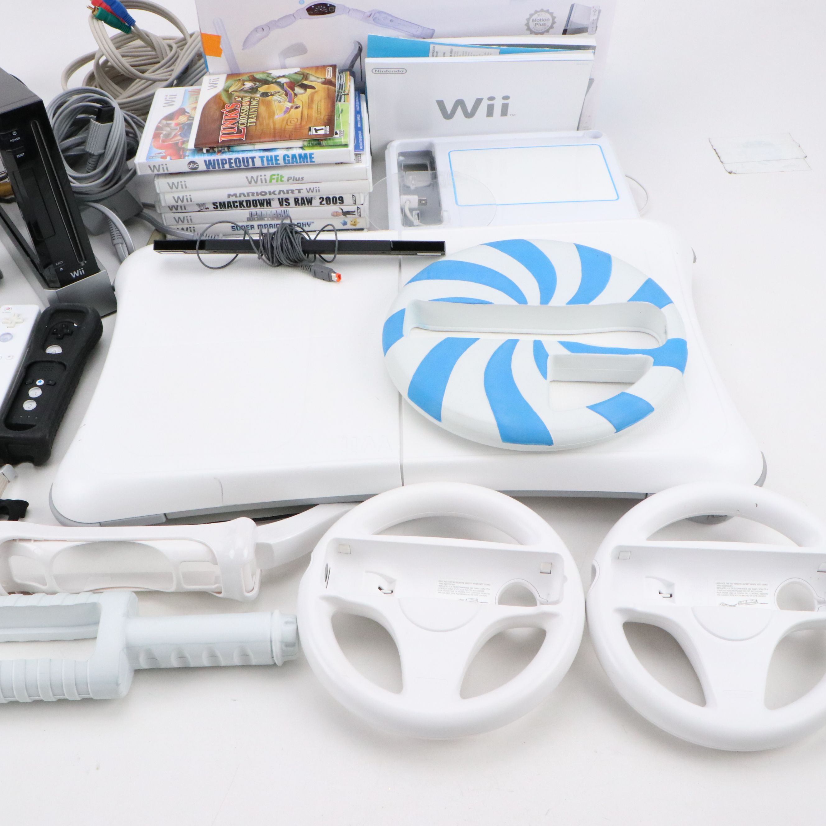 Nintendo Wii with Wii Fit, Wii Sports, and Other Games and Accessories