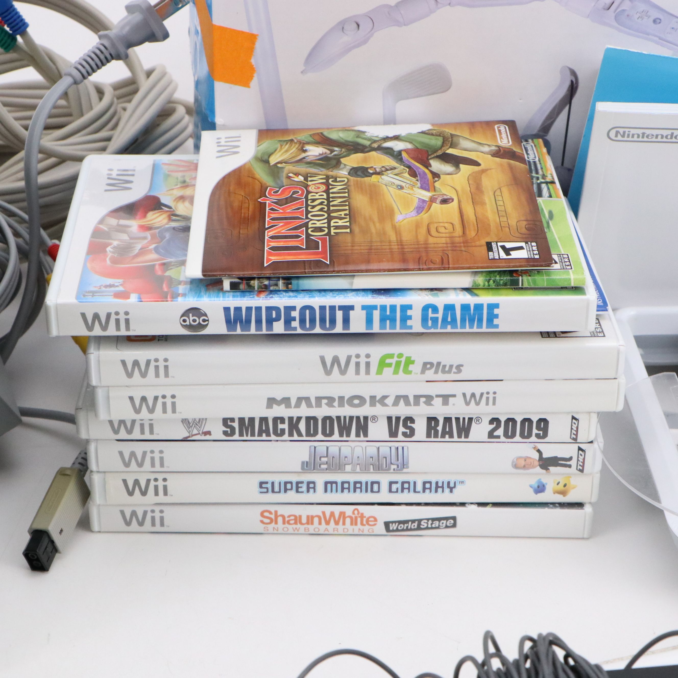 Nintendo Wii with Wii Fit, Wii Sports, and Other Games and Accessories