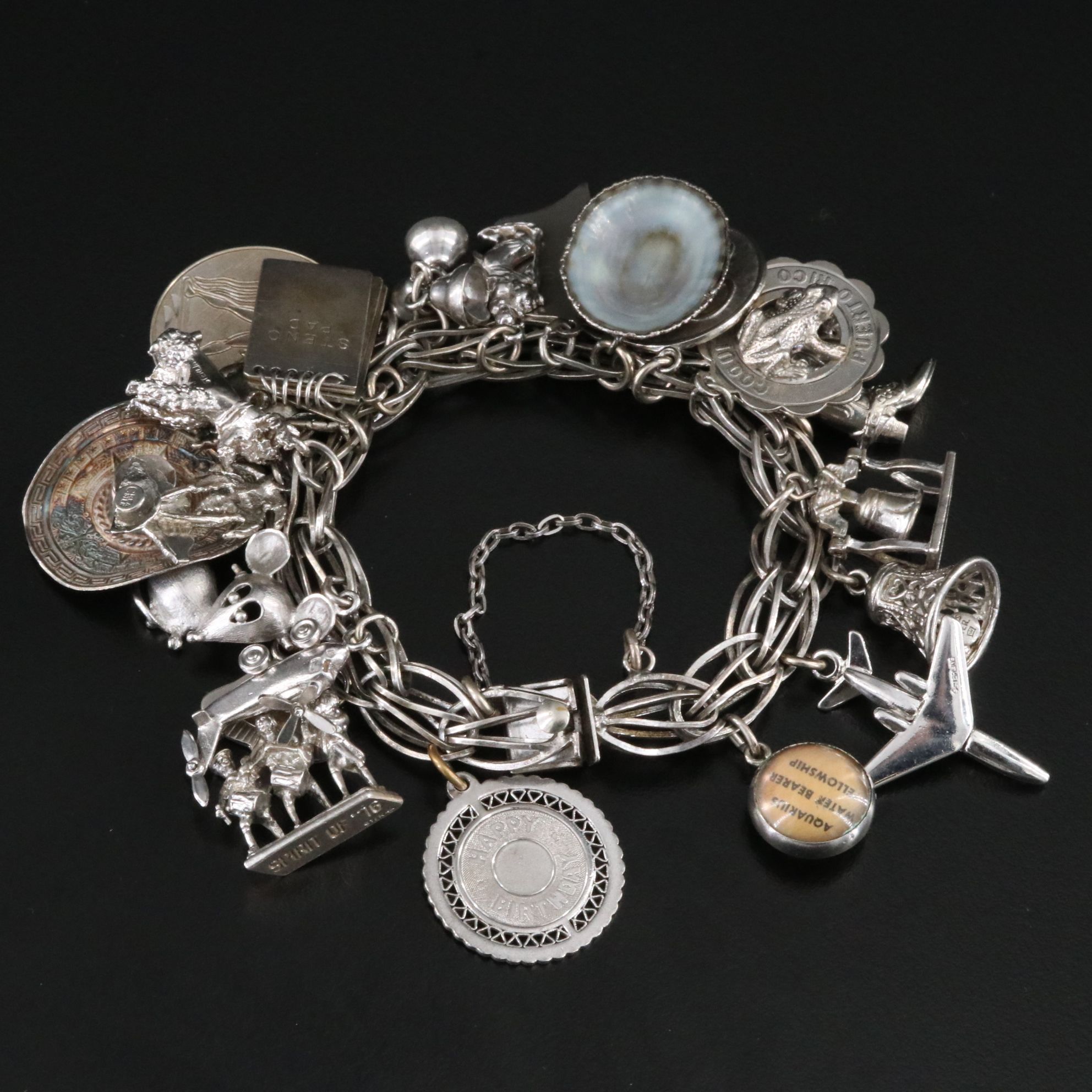Sterling Bracelet Including Travel and Commemorative Charms
