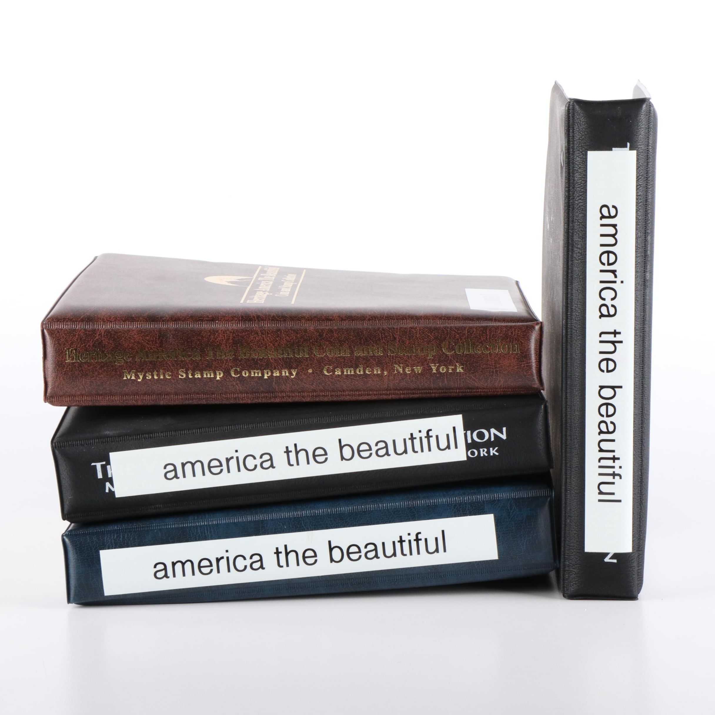 Four Albums of America the Beautiful Quarters and Related Postage Stamps