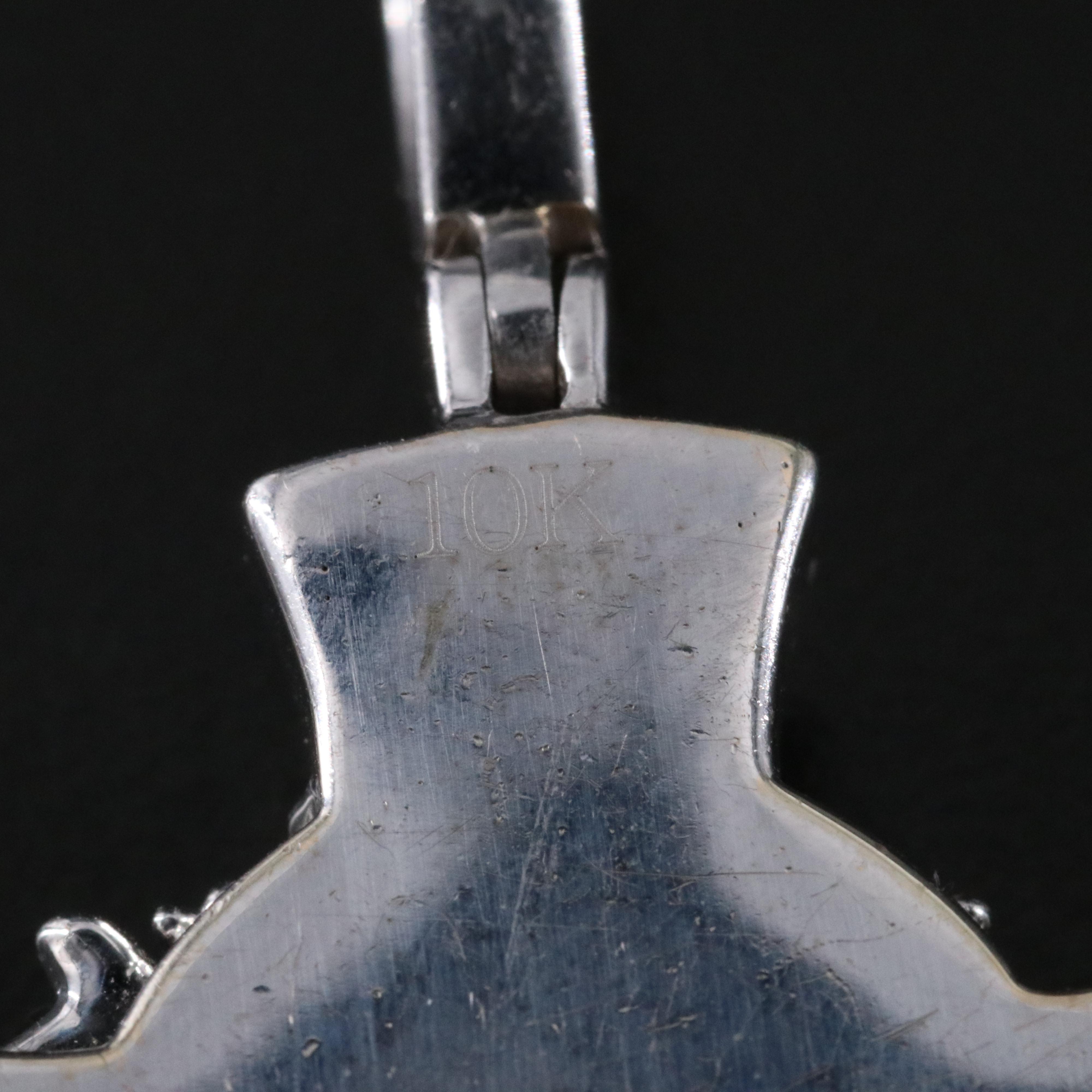 10K 1.17 CTW Diamond and Enamel Figural Cross Pendant