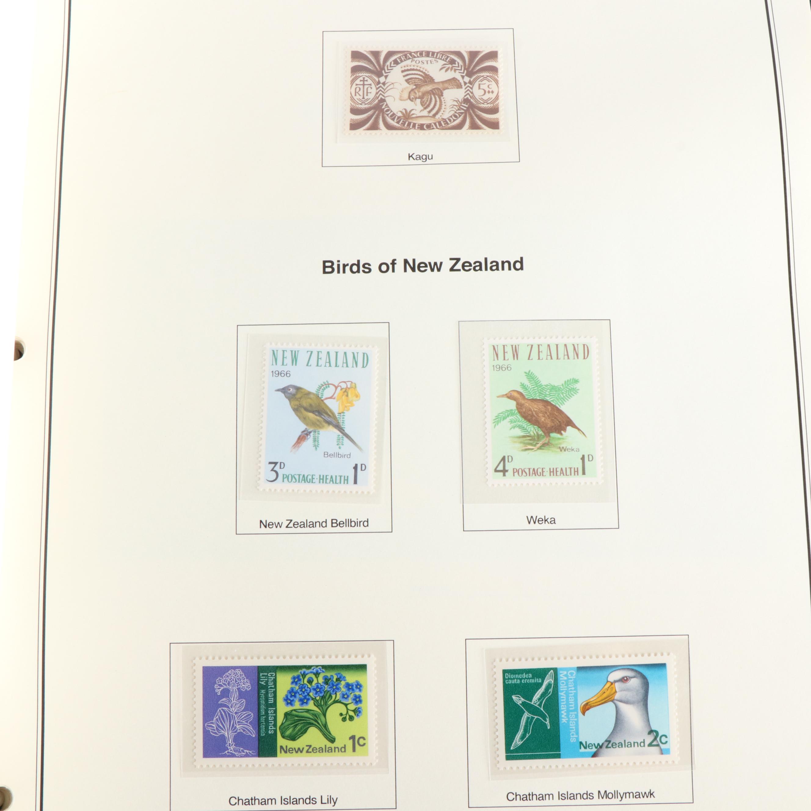 Four Albums of Themed Postage Stamps, Birds, Fish, and More