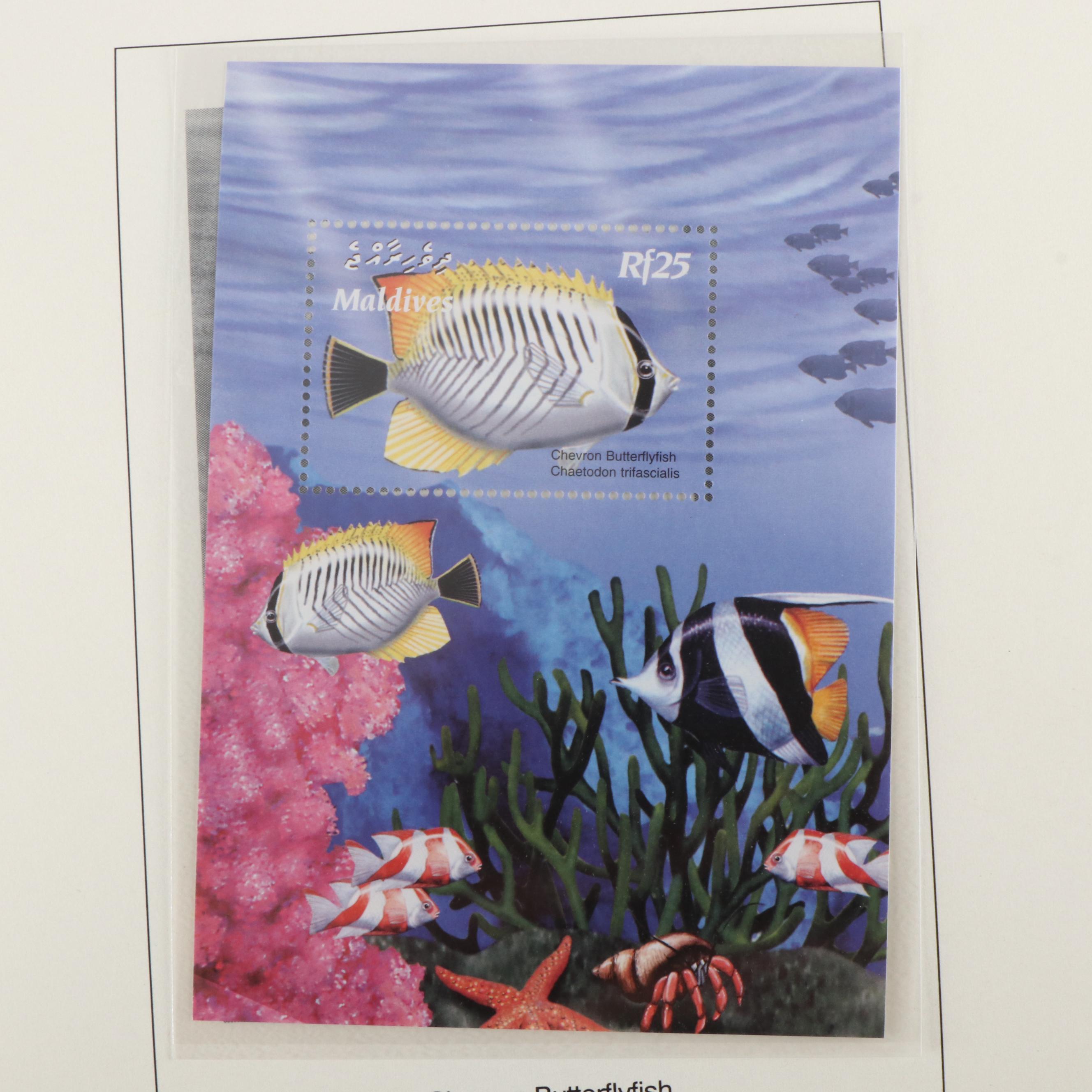 Four Albums of Themed Postage Stamps, Birds, Fish, and More