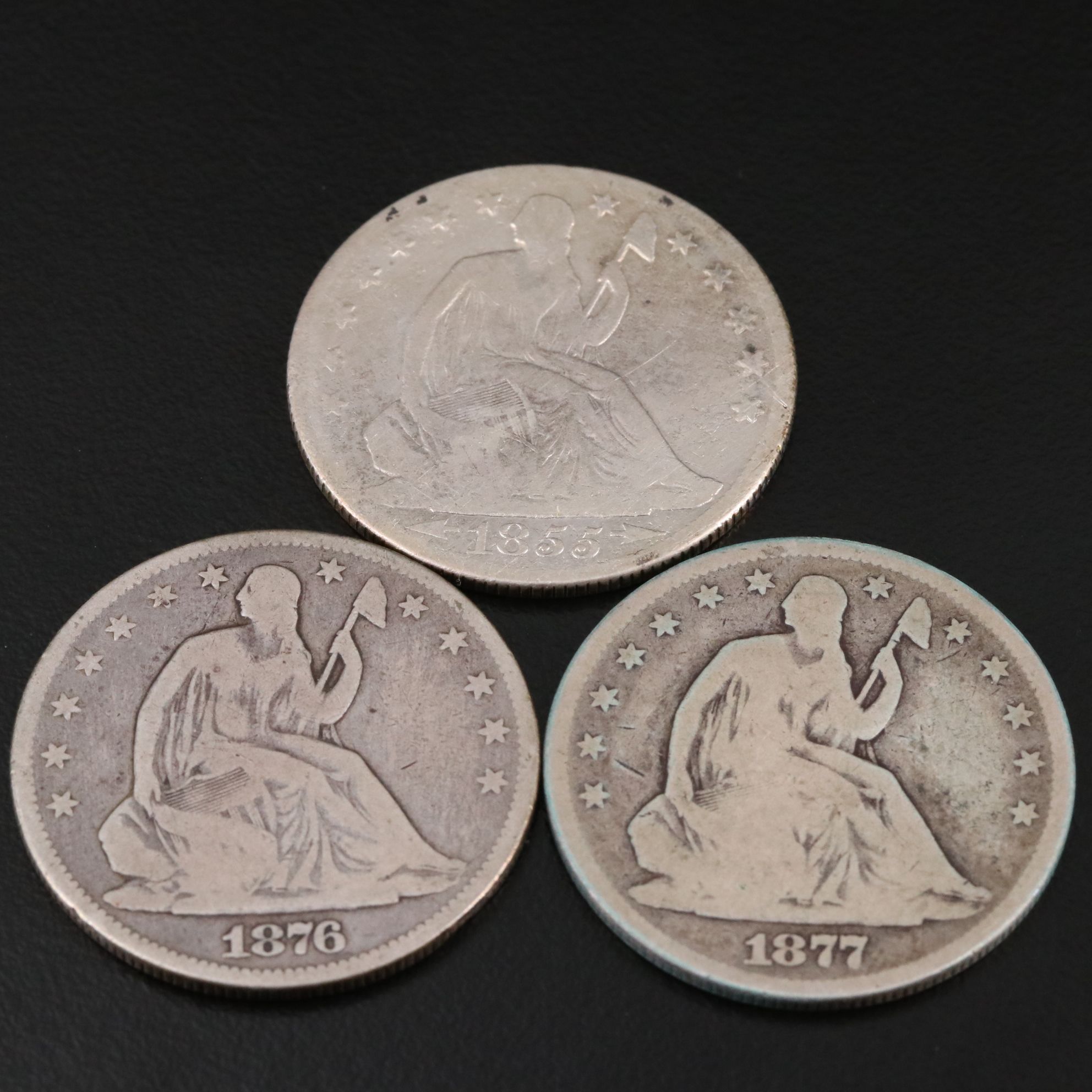 Three Seated Liberty Silver Half Dollars Including an 1876