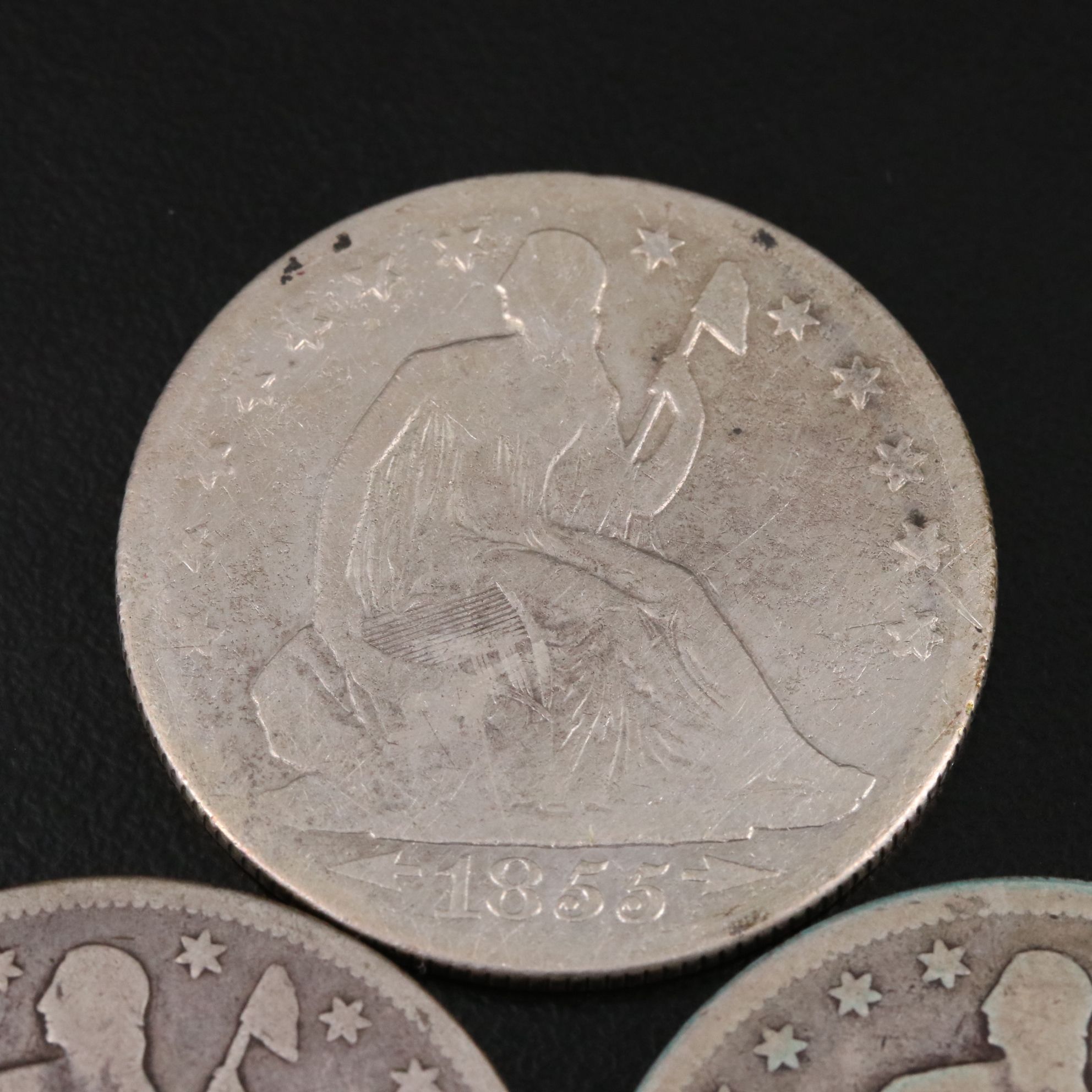 Three Seated Liberty Silver Half Dollars Including an 1876