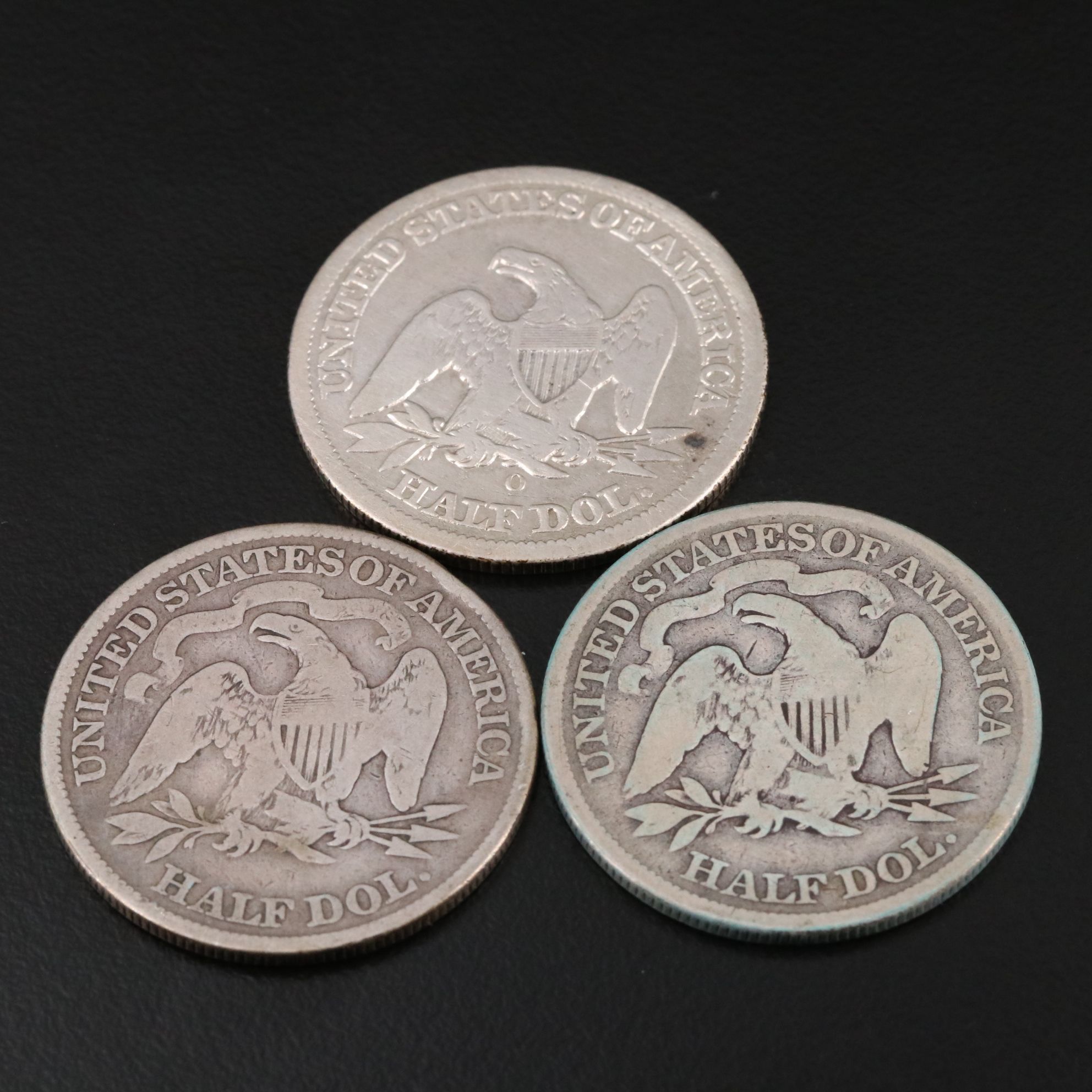Three Seated Liberty Silver Half Dollars Including an 1876