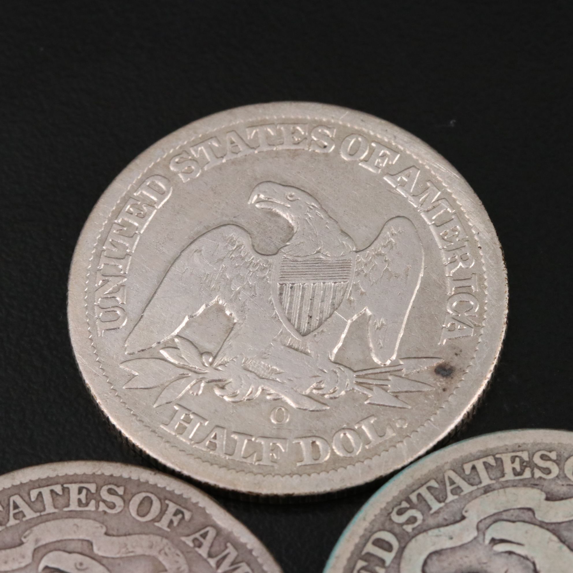 Three Seated Liberty Silver Half Dollars Including an 1876