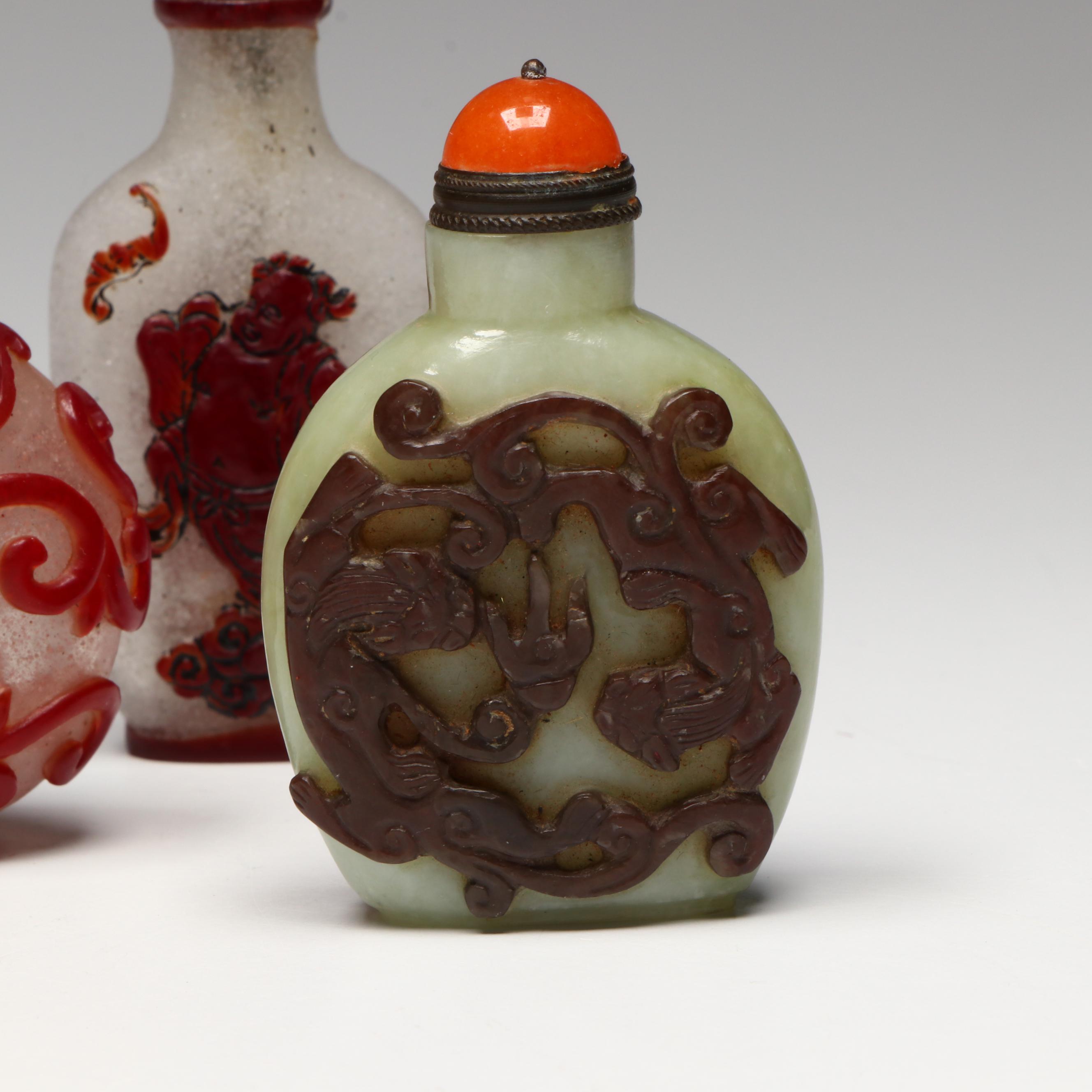 Chinese Carved Serpentine, Quartz and Coral Snuff Bottles