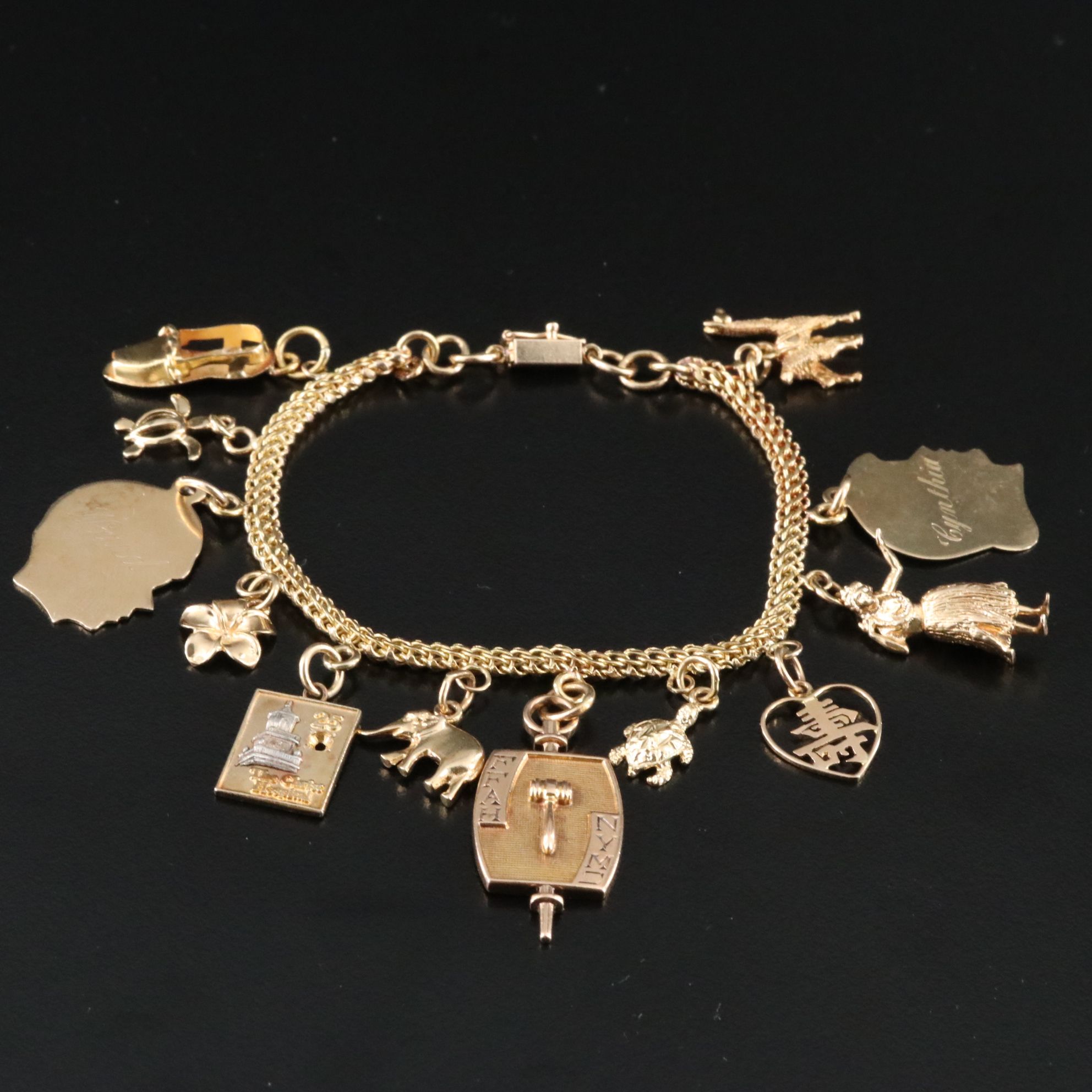 14K Charm Bracelet Including 10K, 18K and Articulated