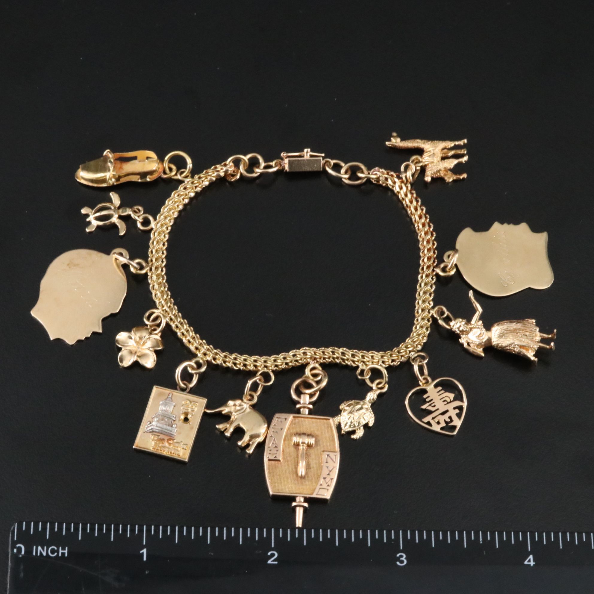 14K Charm Bracelet Including 10K, 18K and Articulated