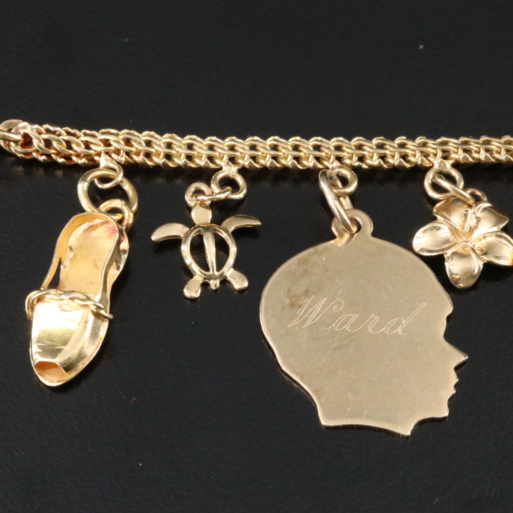 14K Charm Bracelet Including 10K, 18K and Articulated
