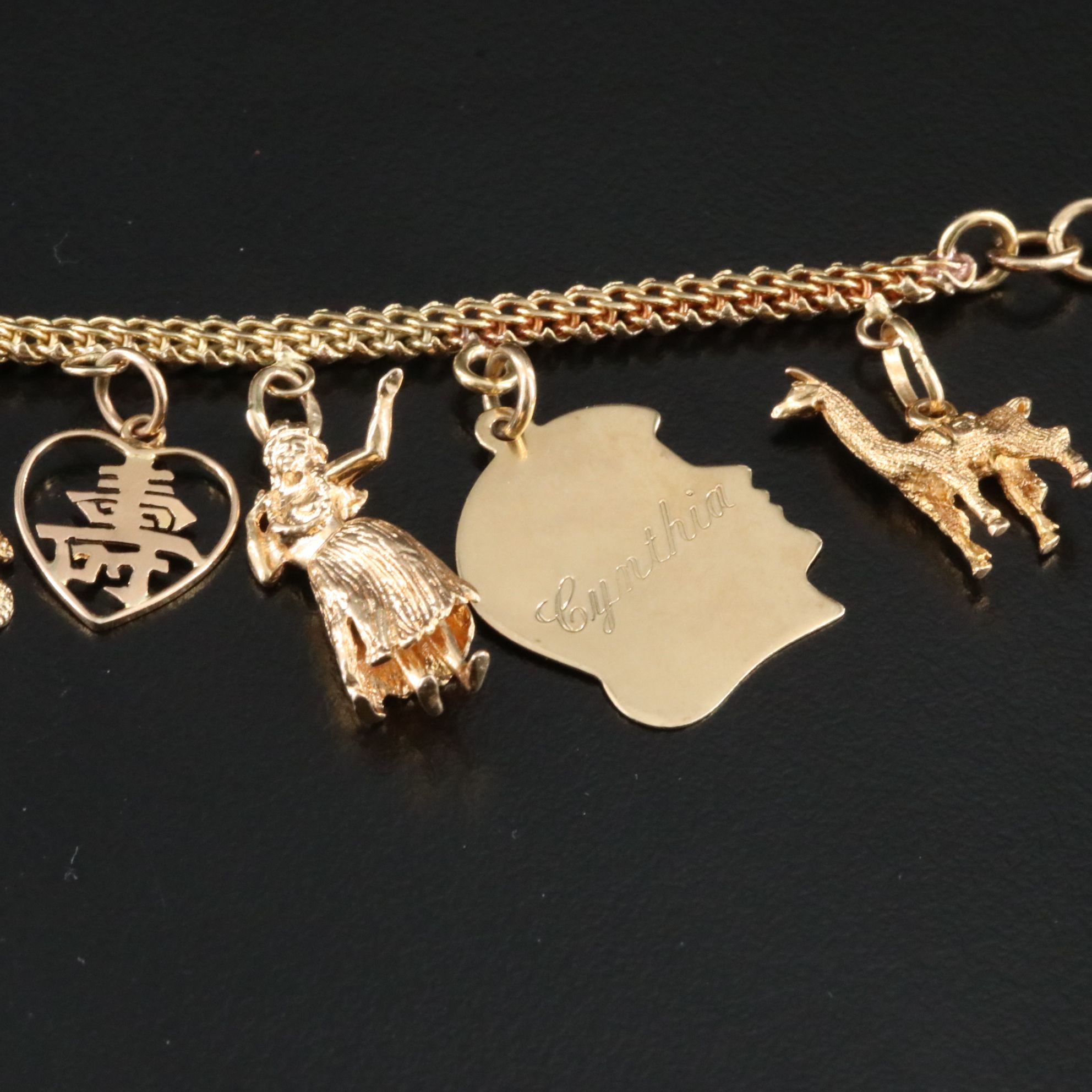 14K Charm Bracelet Including 10K, 18K and Articulated