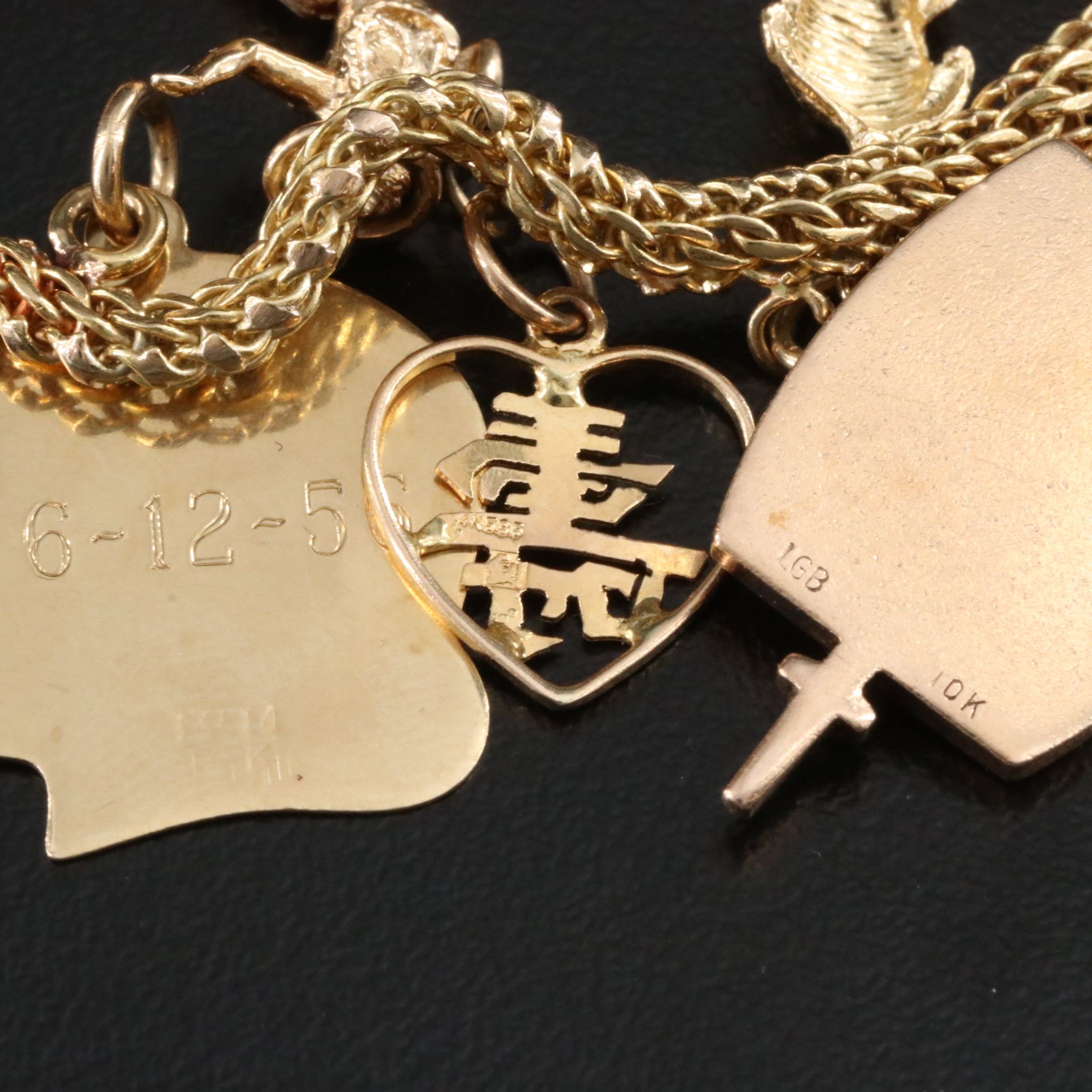 14K Charm Bracelet Including 10K, 18K and Articulated