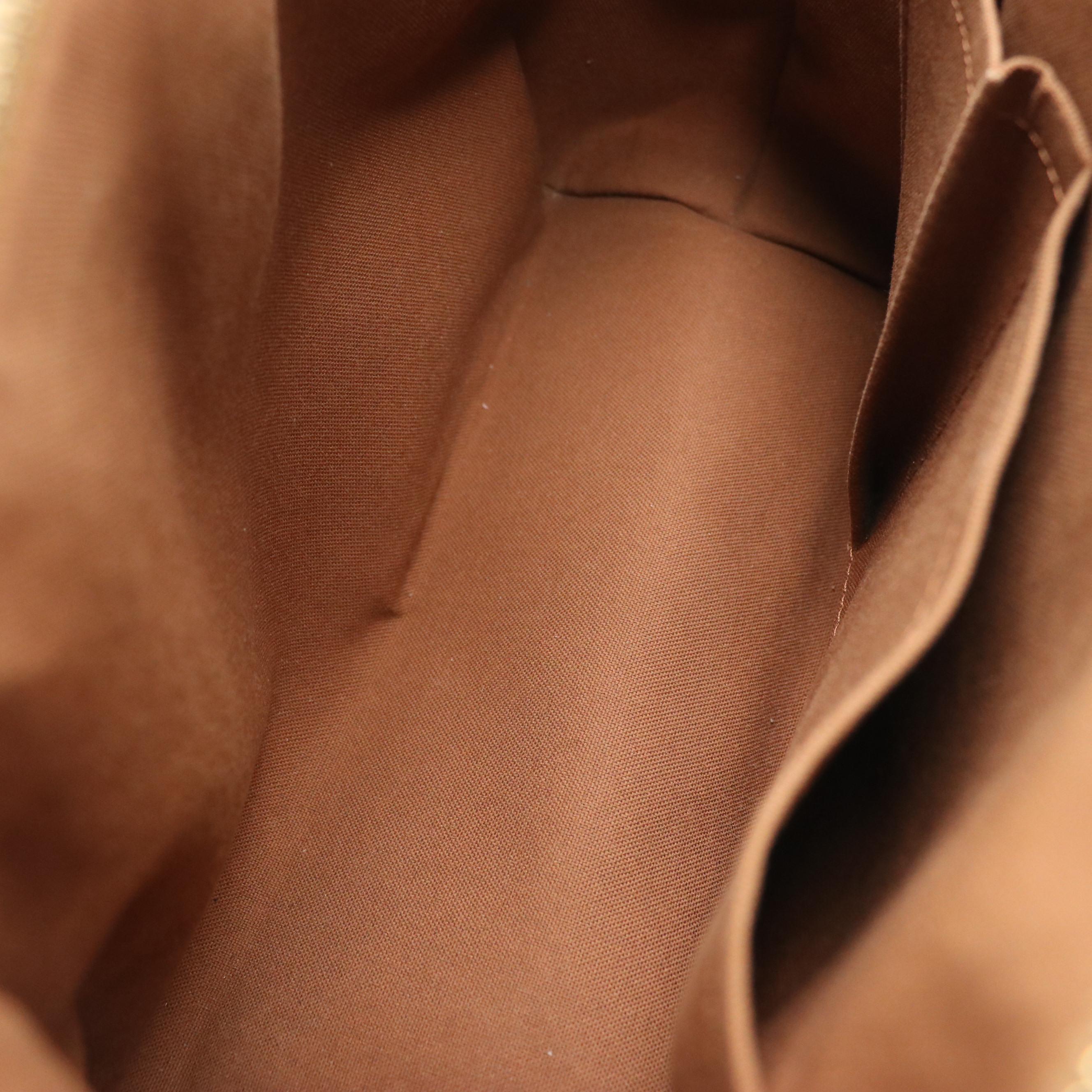 Louis Vuitton Tivoli PM Handbag in Monogram Canvas and Vachetta Leather