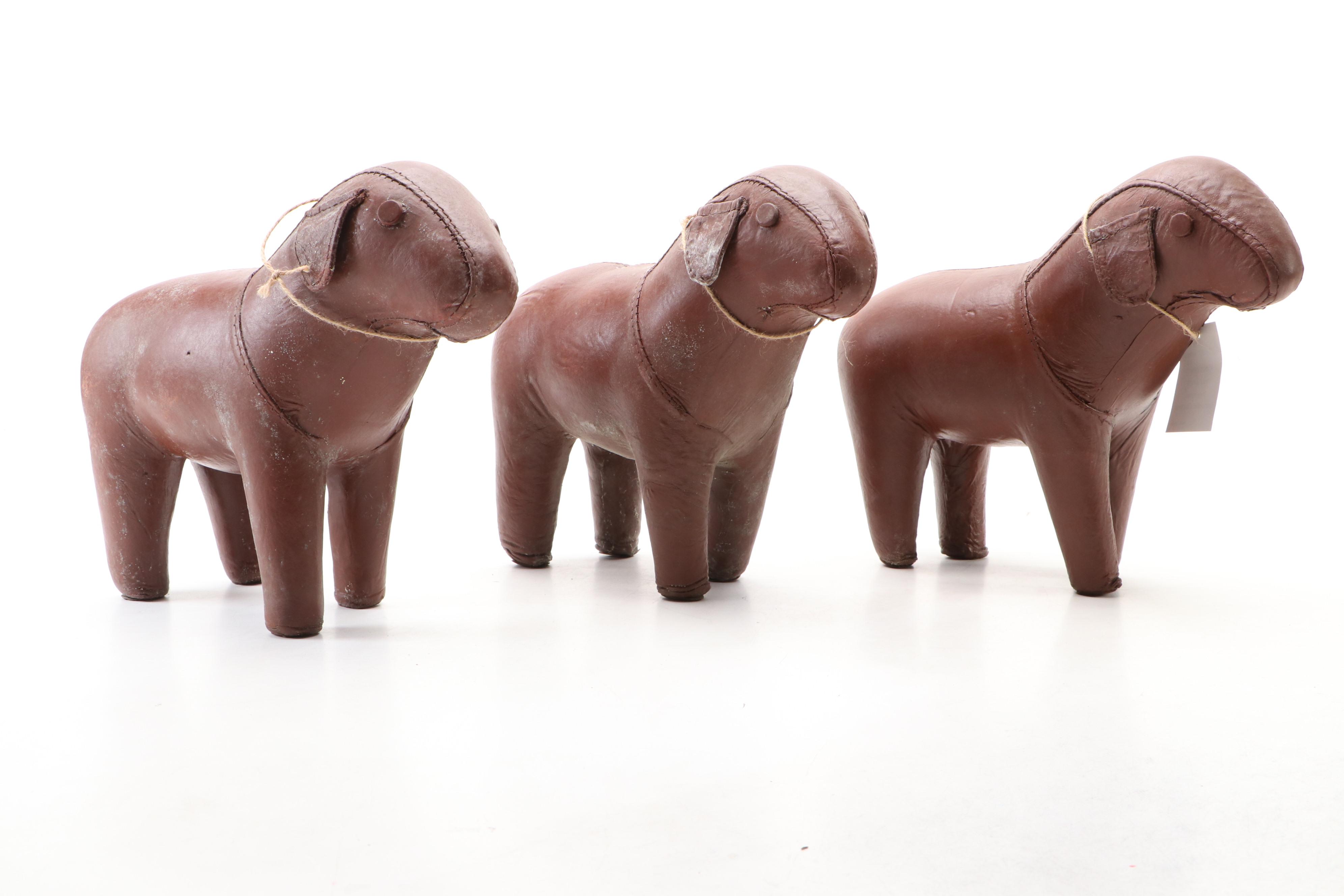 Three Stitched Brown Leather Dogs