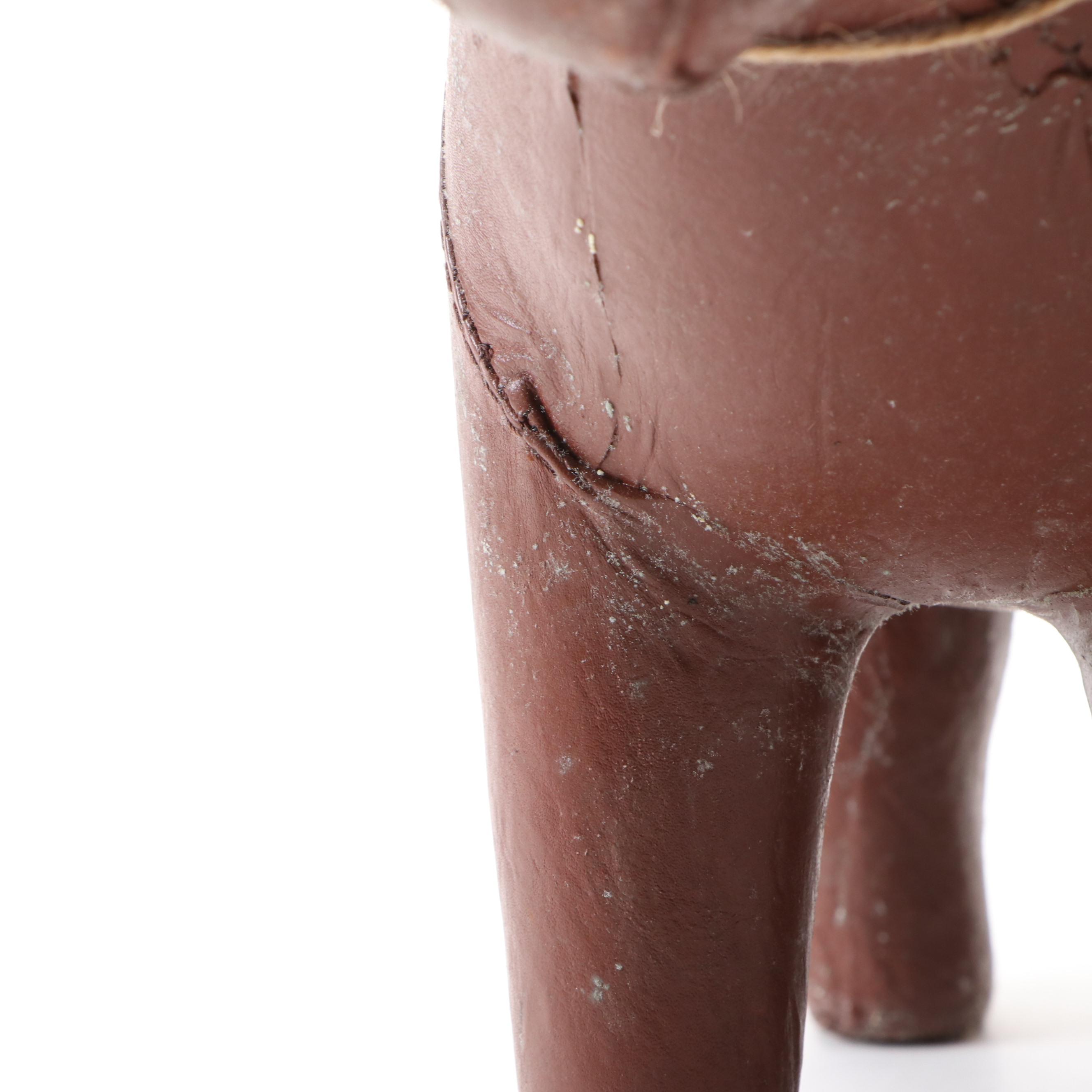 Three Stitched Brown Leather Dogs