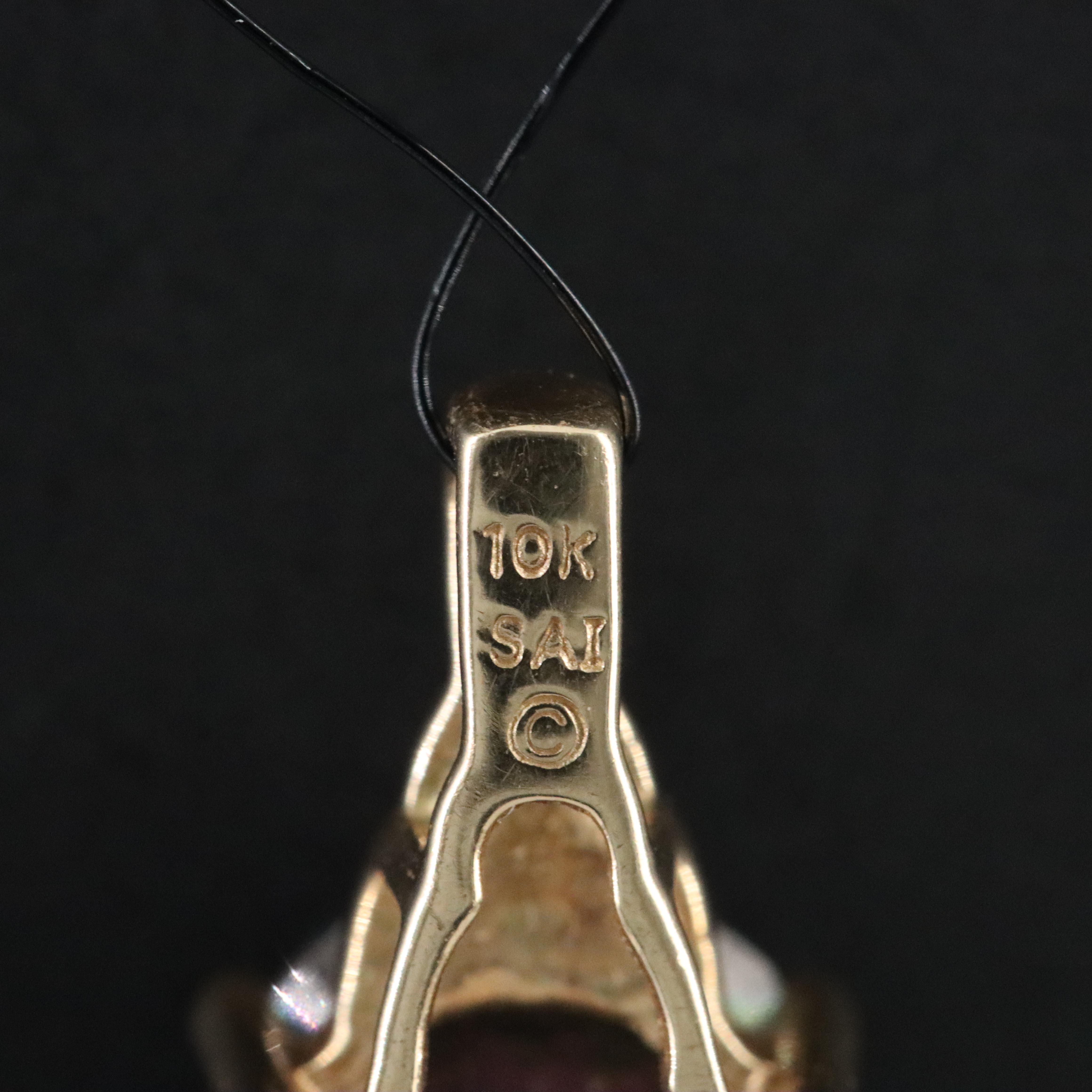 10K Mystic Topaz and Diamond Accent Pendant