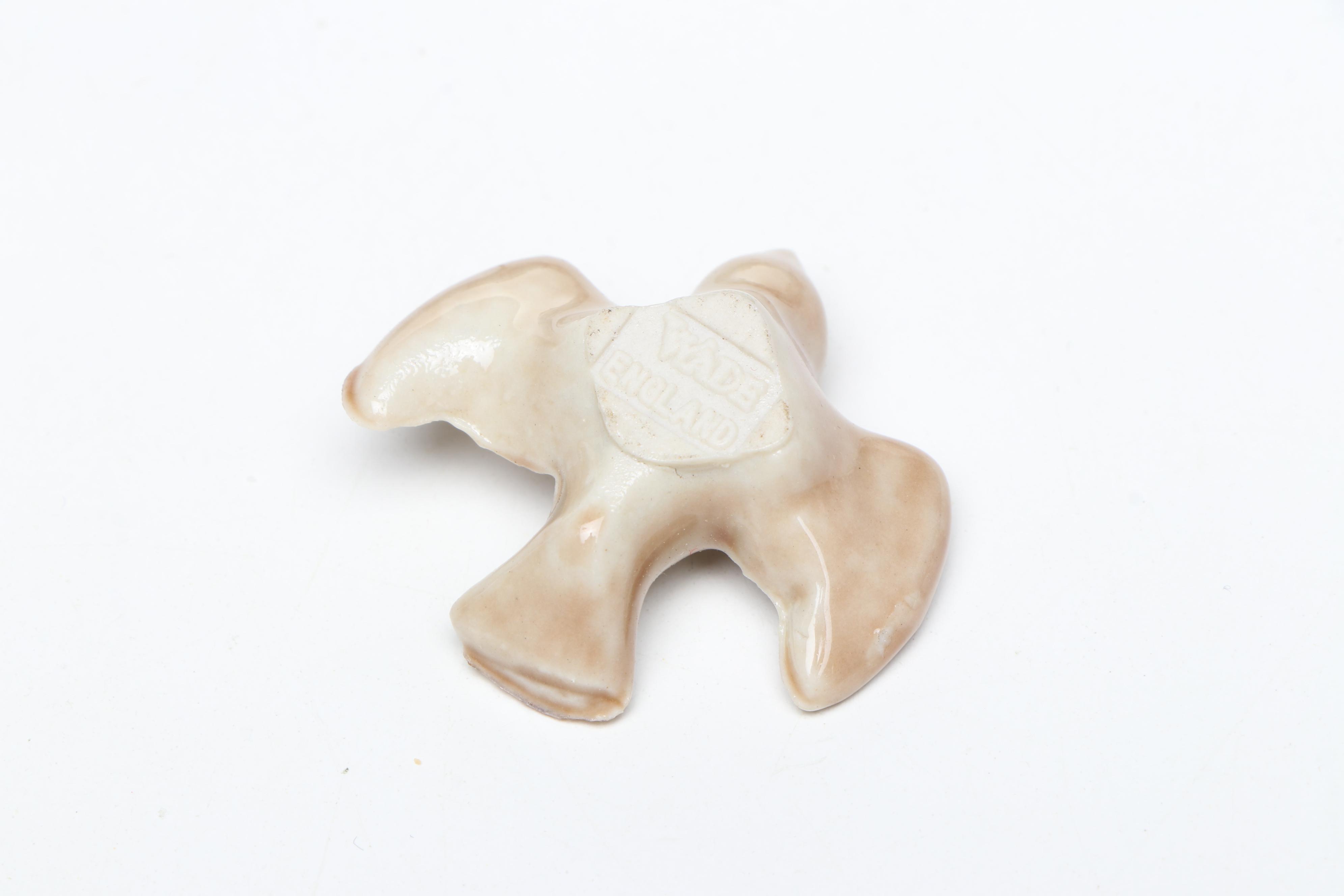 Animal Ceramic Figurines Featuring Raccoons, Rhinoceroses, and Giraffes