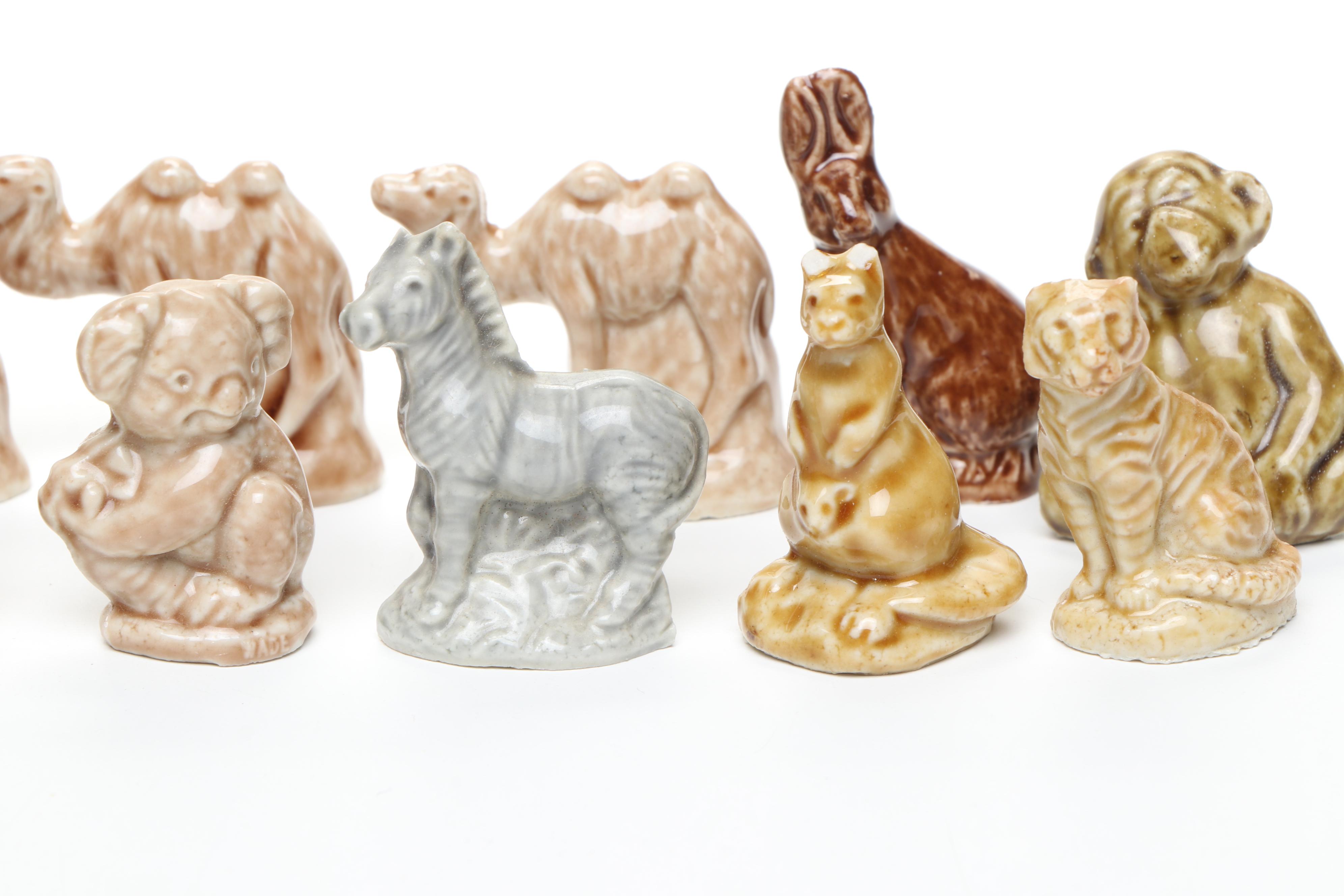Animal Ceramic Figurines Featuring Raccoons, Rhinoceroses, and Giraffes