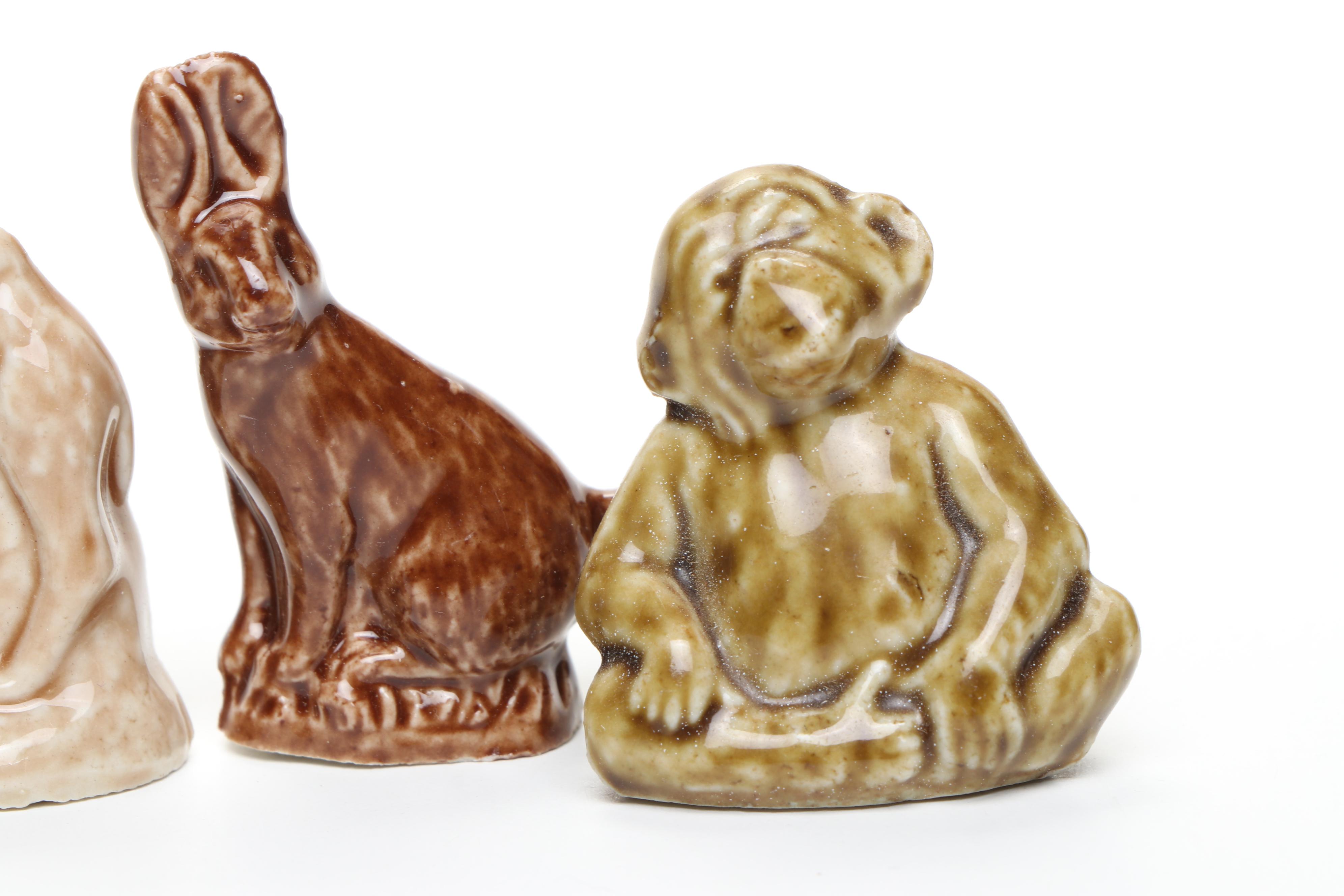 Animal Ceramic Figurines Featuring Raccoons, Rhinoceroses, and Giraffes